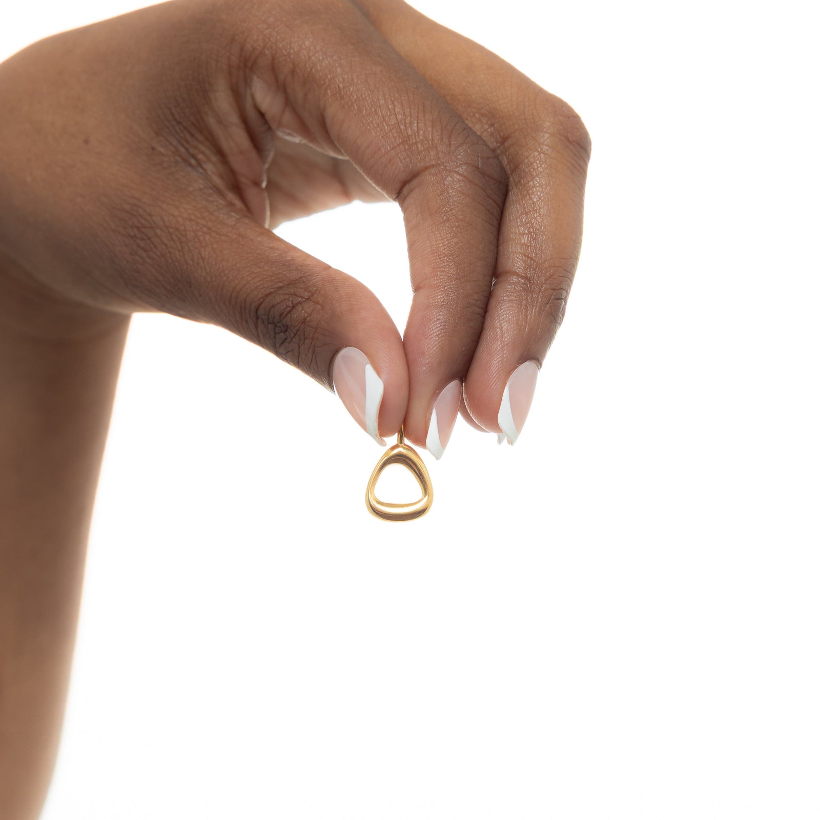 Close-up of the gold-plated Arabic number charm "5" with an iridescent pearl background, polished and detailed.