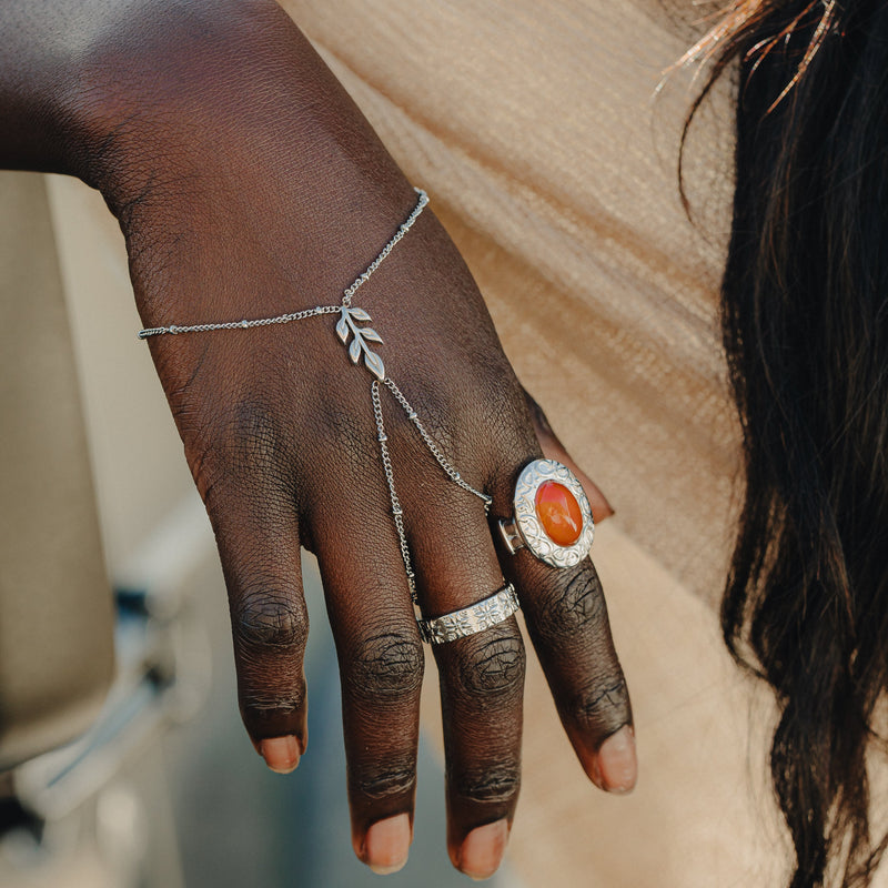 Silver Palestinian Olive Branch Hand Chain  styled with silver rings.