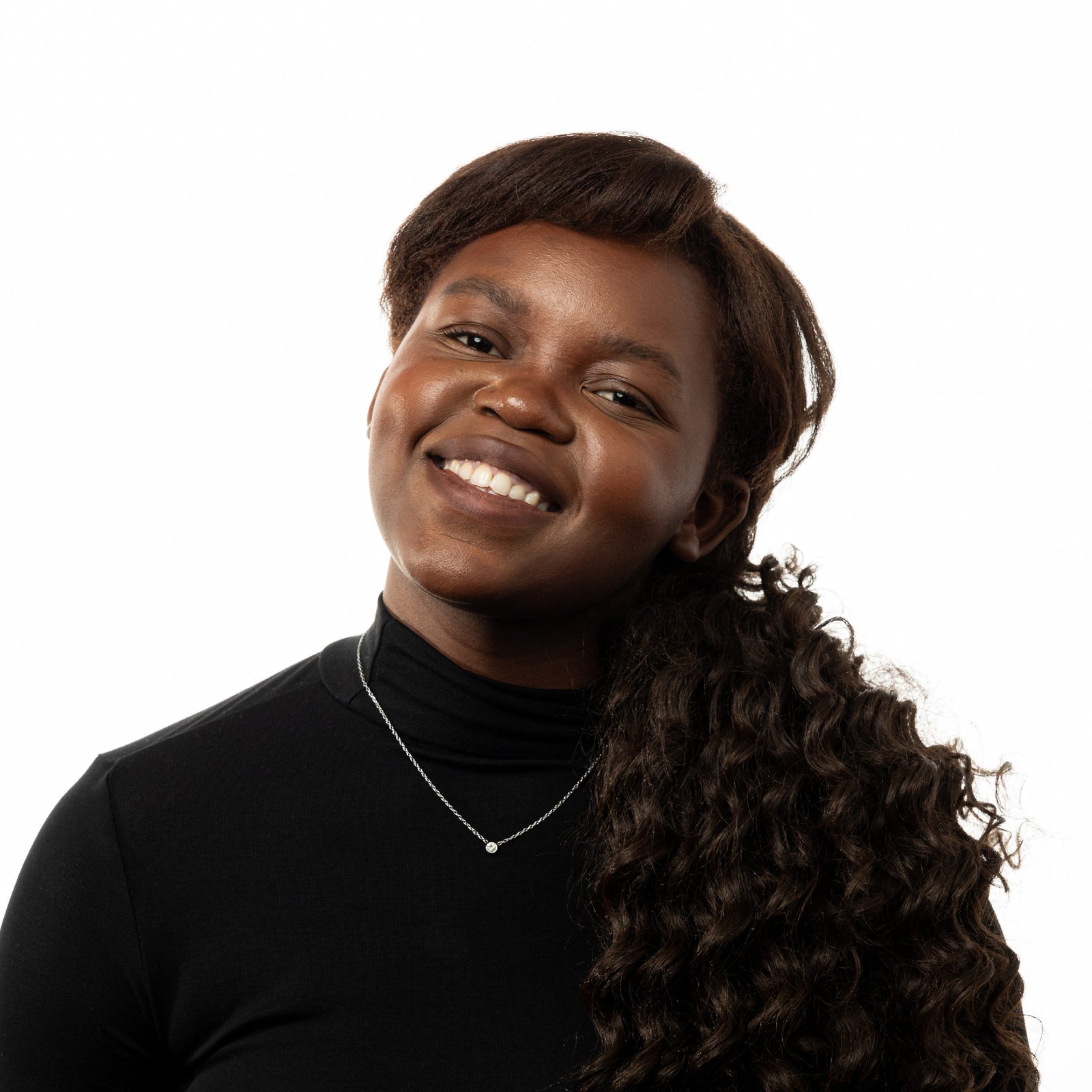 Photo of the model smiling to the camera. The model is wearing the silver Bezel Necklace.