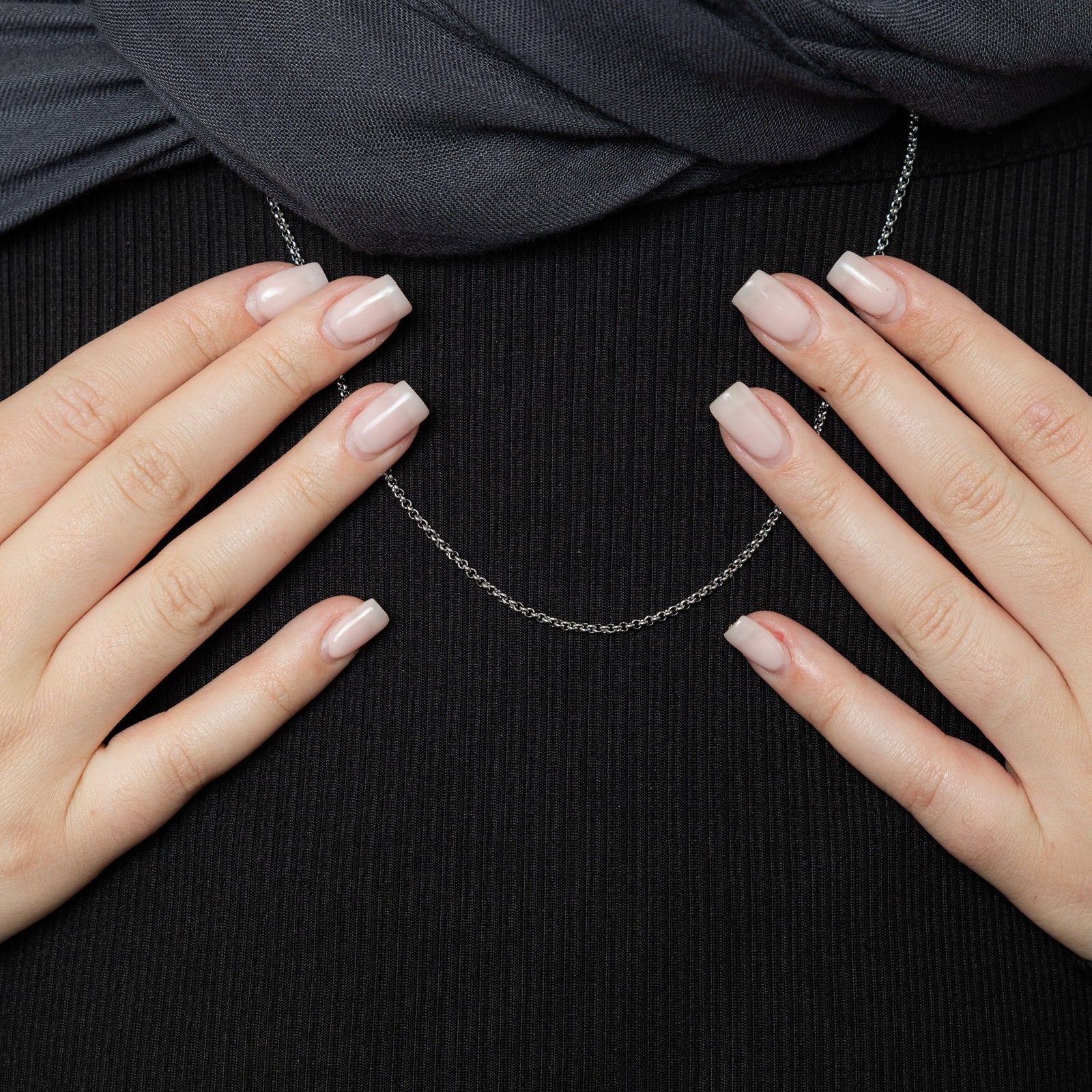 Close up of the silver Micro Box Chain as worn by the model