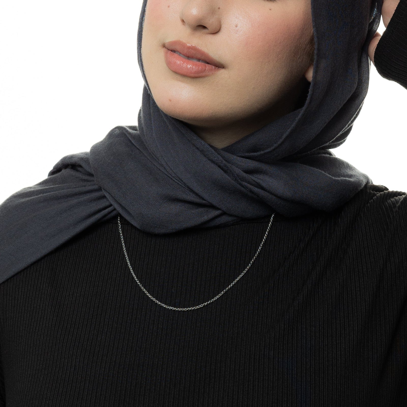 Photo of the silver Micro Box Chain as worn by the model