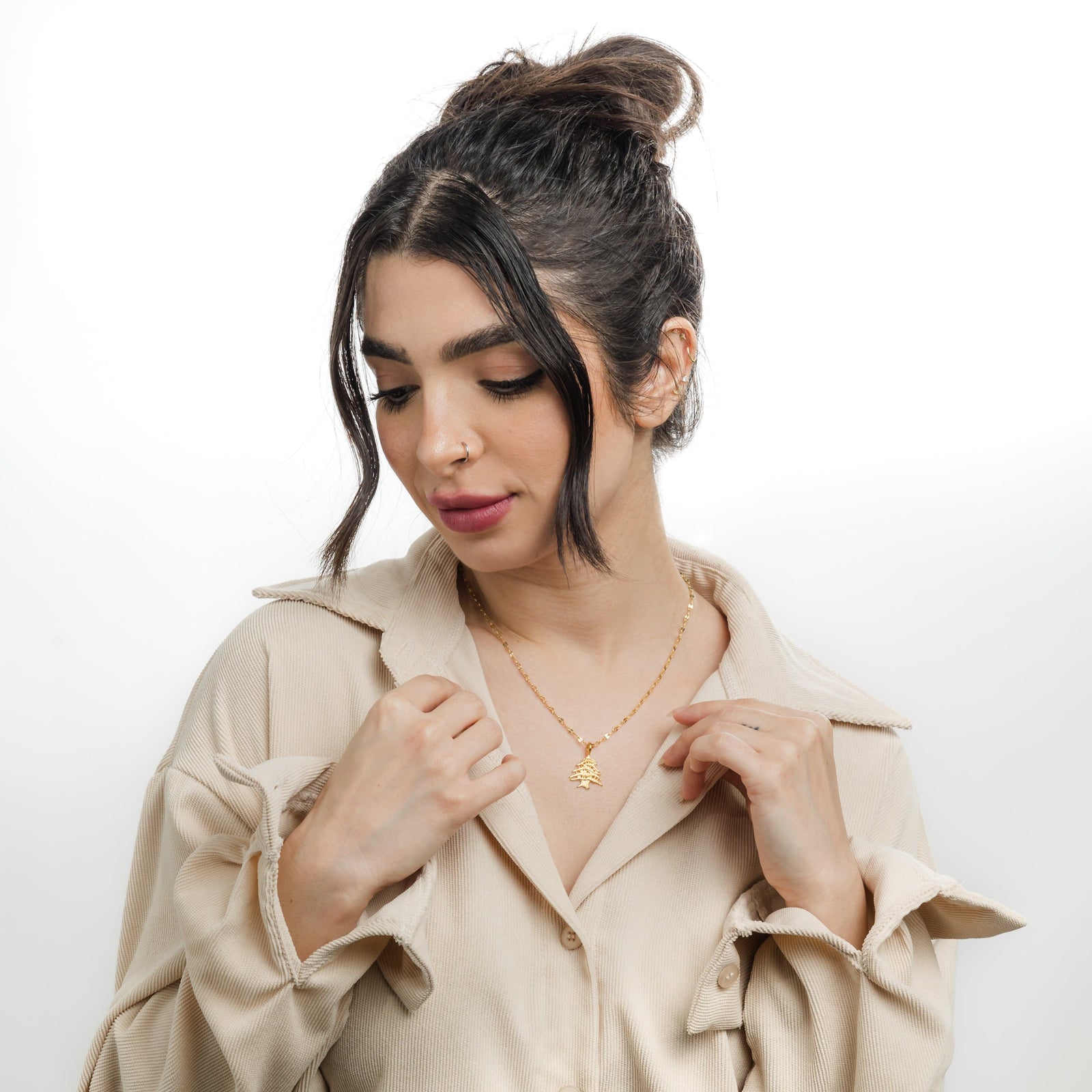 Photo of the model wearing the gold Cedar of Lebanon Necklace.