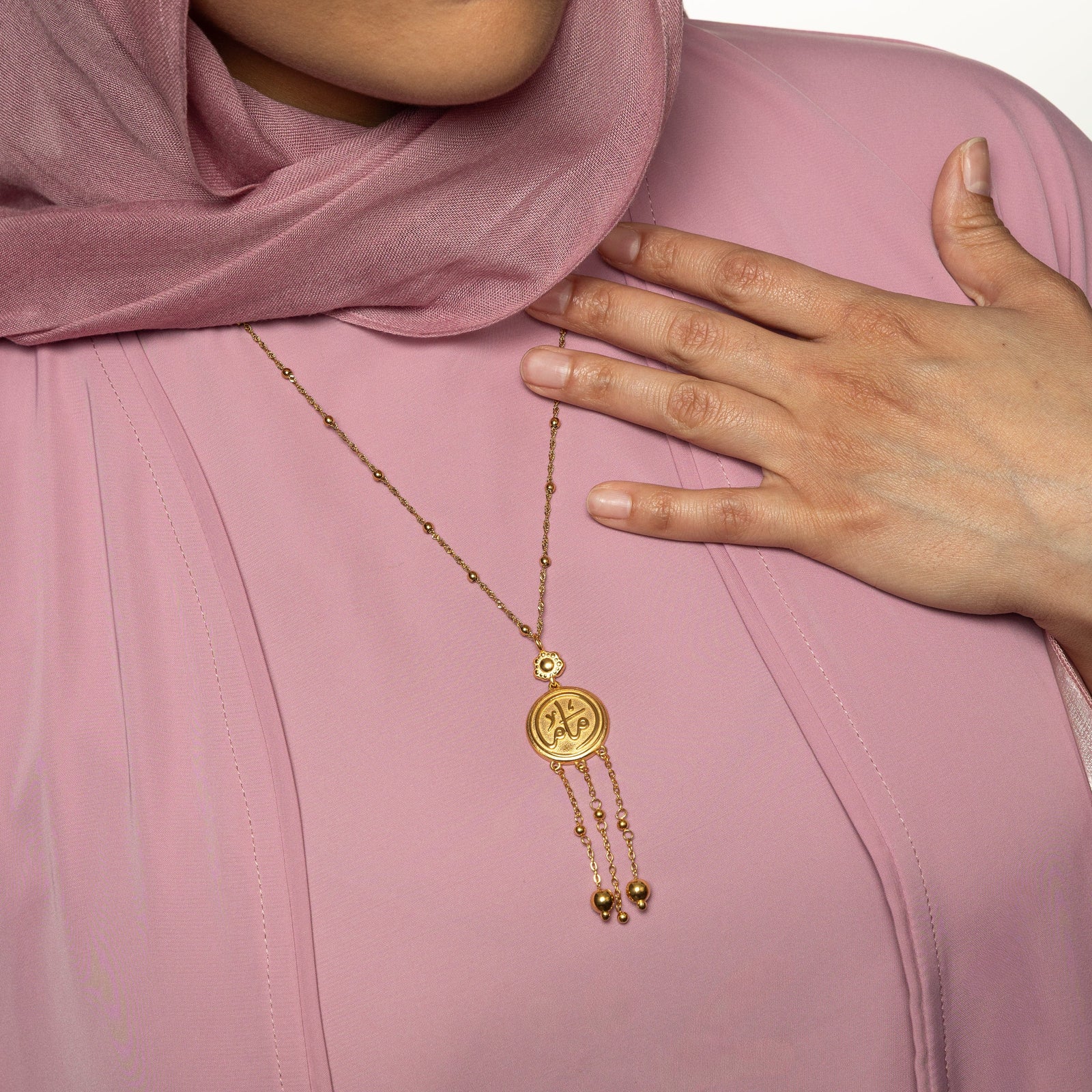 Close up of the Coin Mama Necklace as worn by the model.
