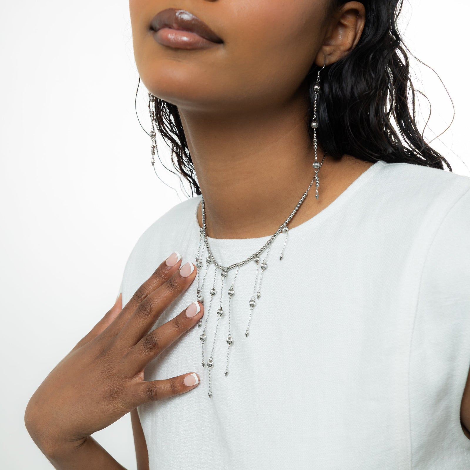 Close up of the gold Comet Choker as worn by the model.
