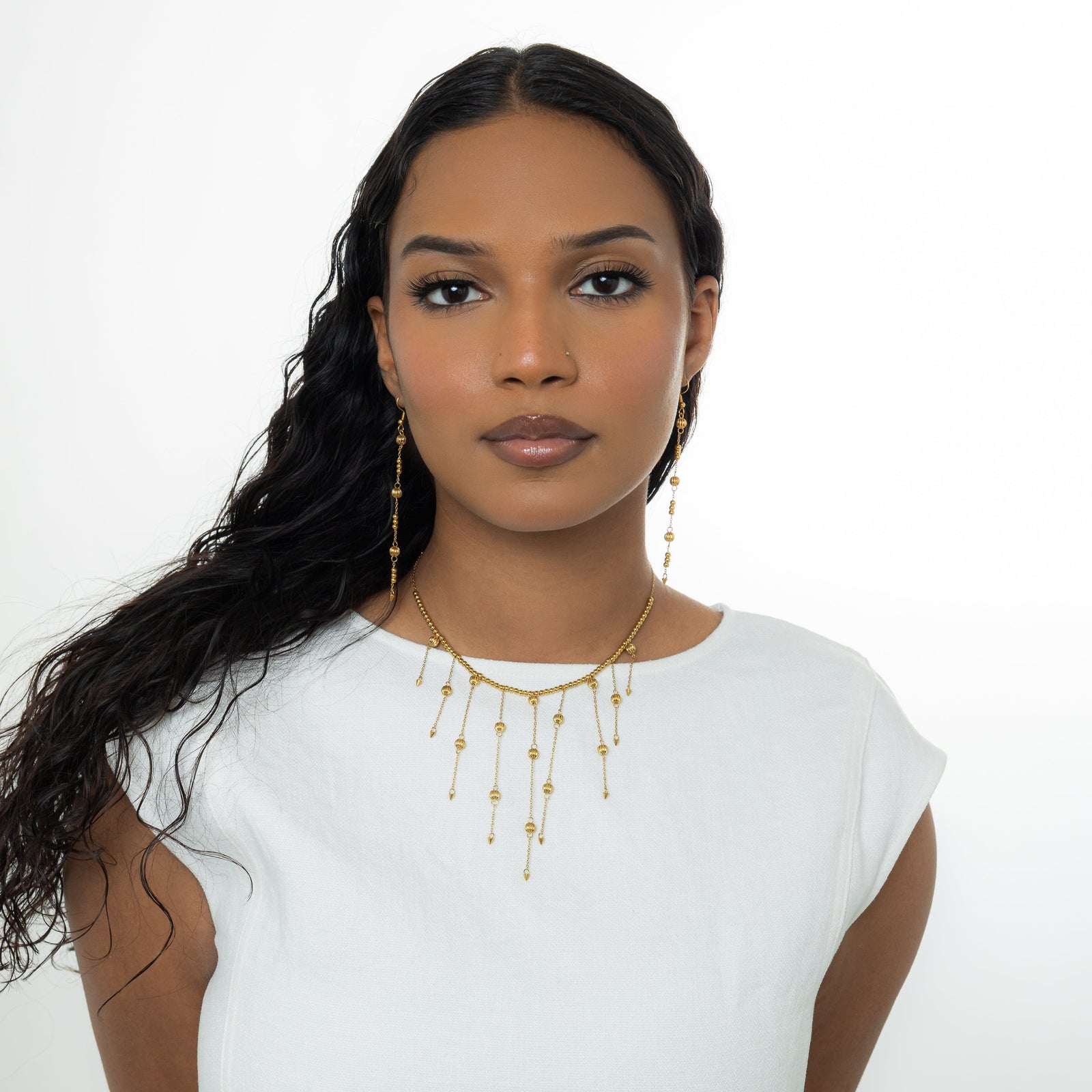 Photo of the model wearing the gold Comet Choker.