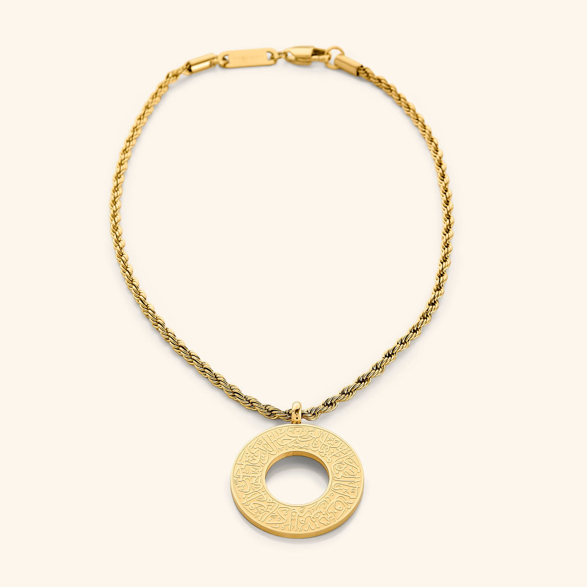 Gold circular car hanger with an open circle center, engraved with Duaa Al-Safar in Arabic calligraphy on a neutral background.
