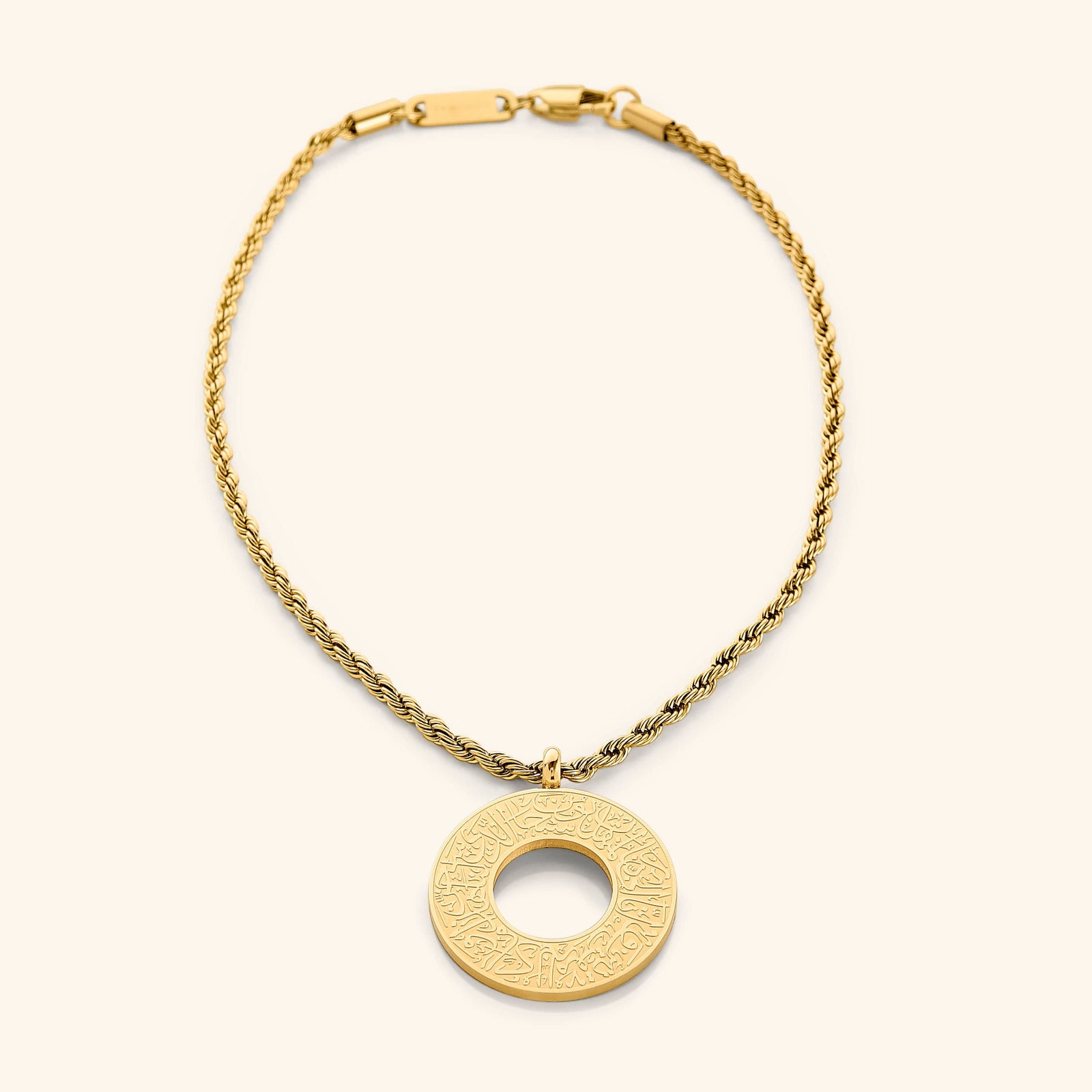 Gold circular car hanger with an open circle center, engraved with Duaa Al-Safar in Arabic calligraphy on a neutral background.