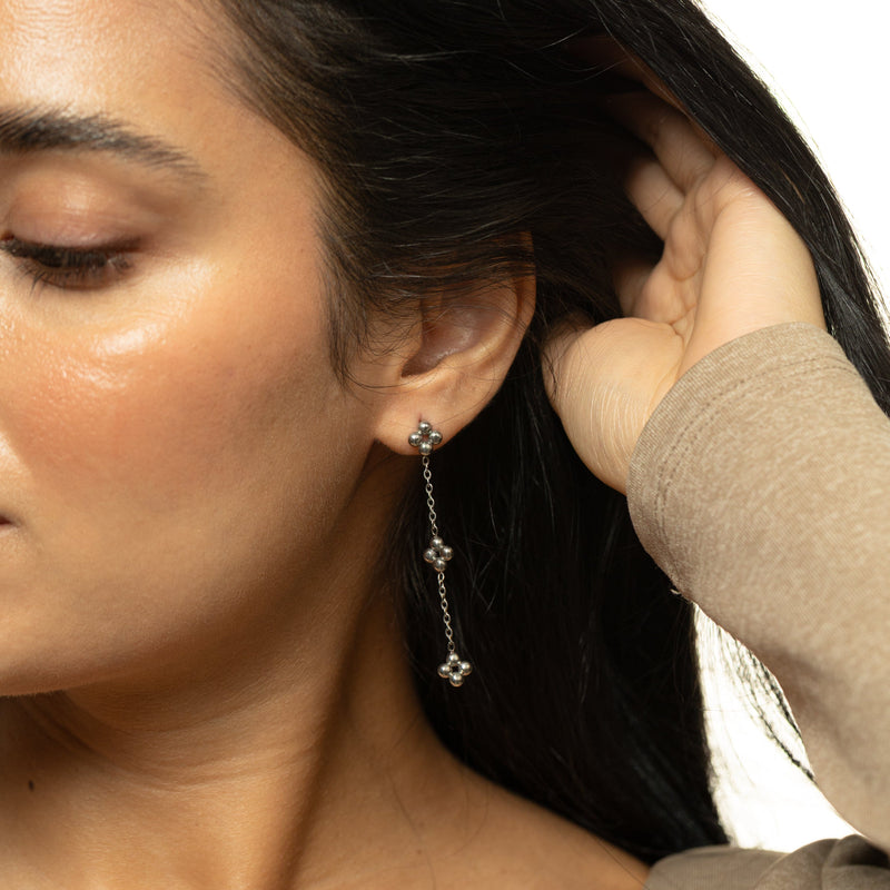 Silver Dangling Henna Earrings with three bead clusters hanging along the chain.