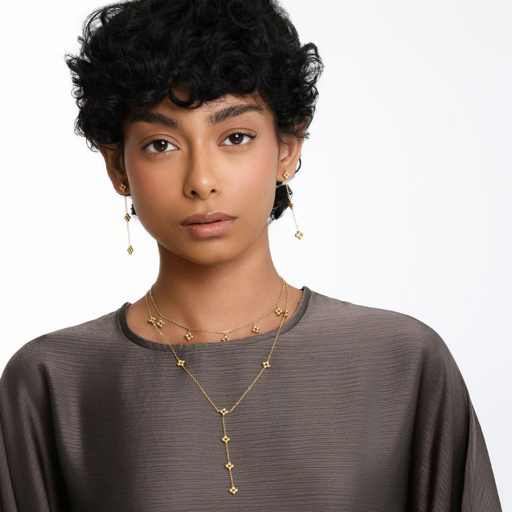 Photo of the model looking to the camera. The model is wearing the matching Dangling Henna Earrings and necklace.