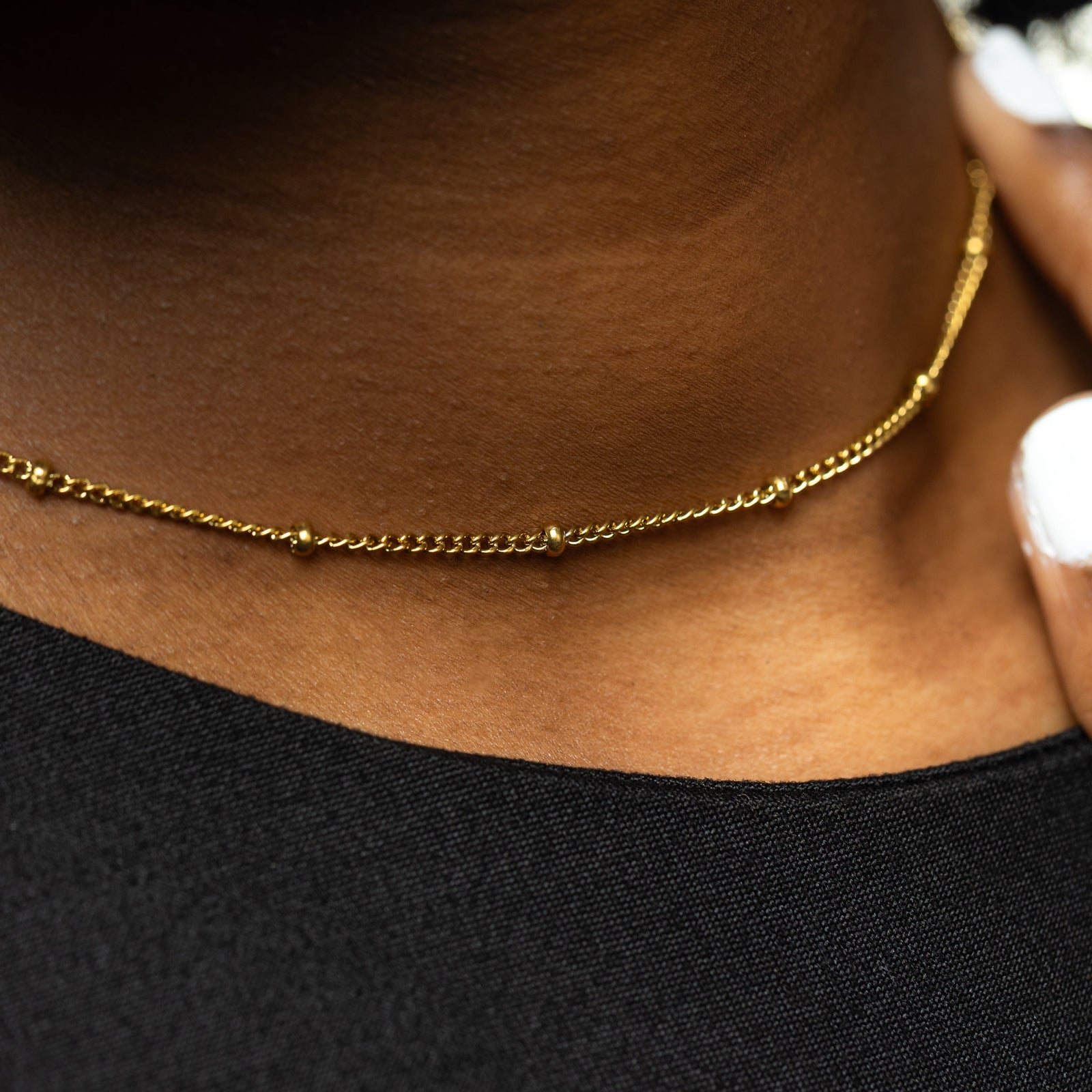 Close up of the Dotted Chain Choker as worn by the model.