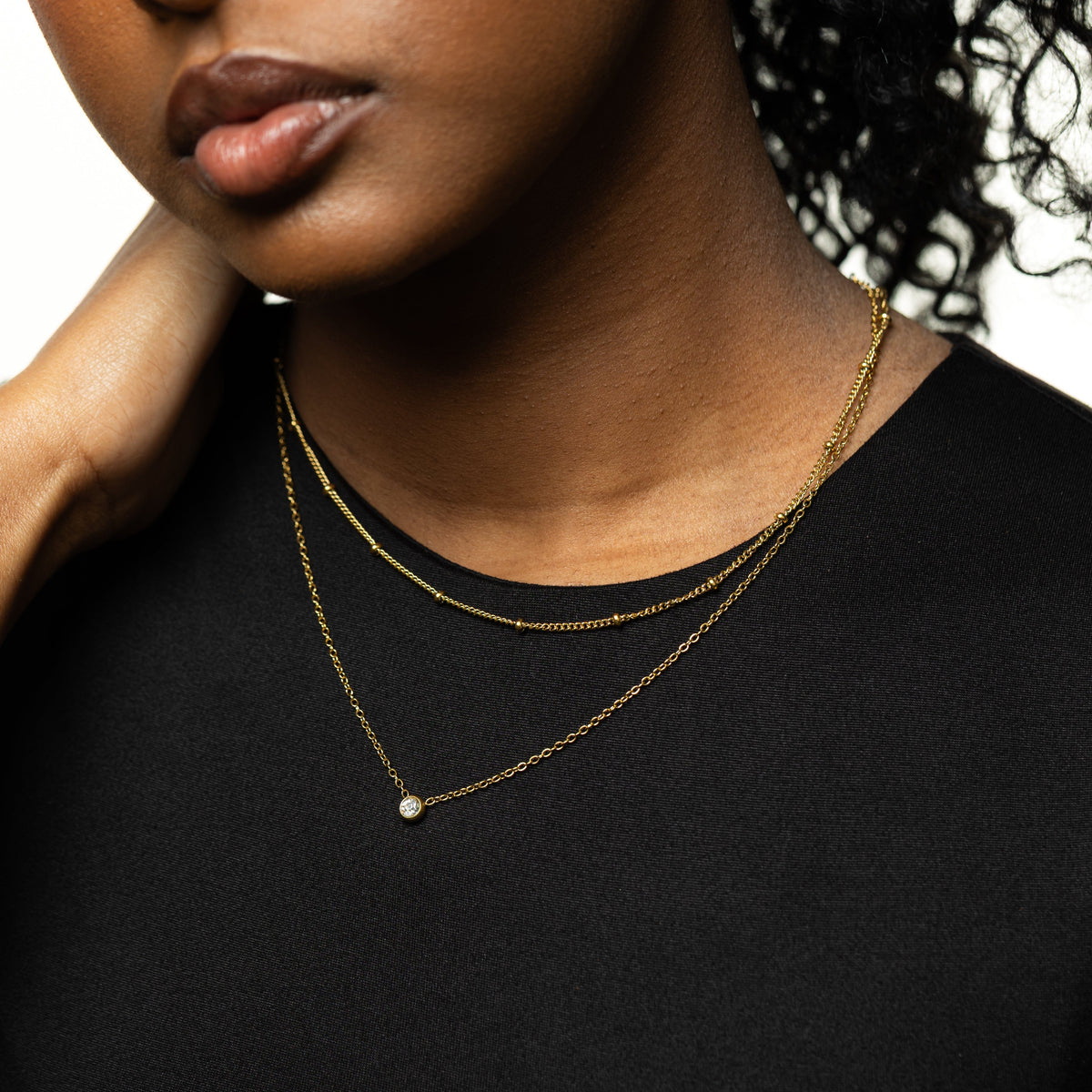 Dotted & Bezel Layering Set worn by the model.