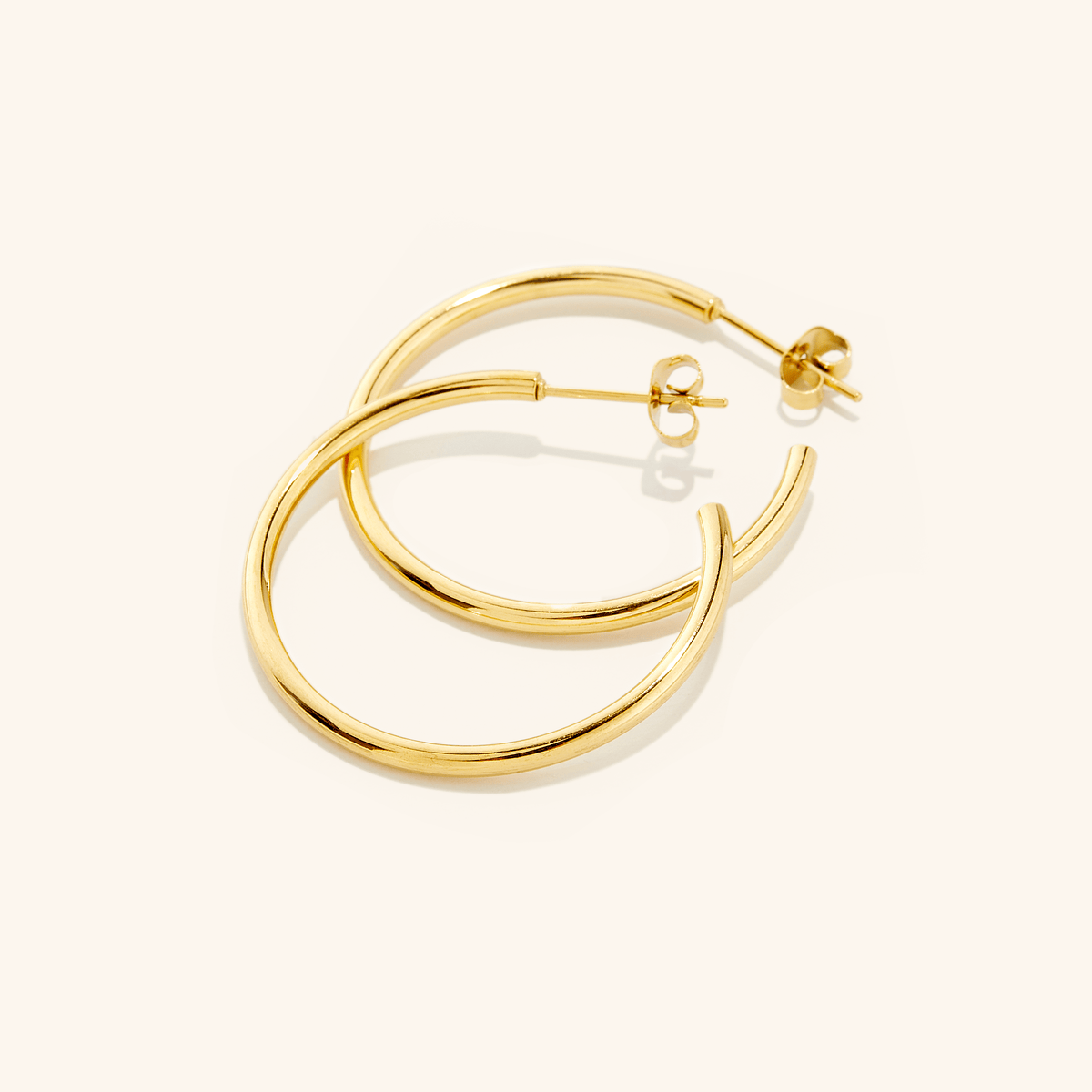 Photo of an 18k gold plated Essential Earrings that is 26mm diameters each.