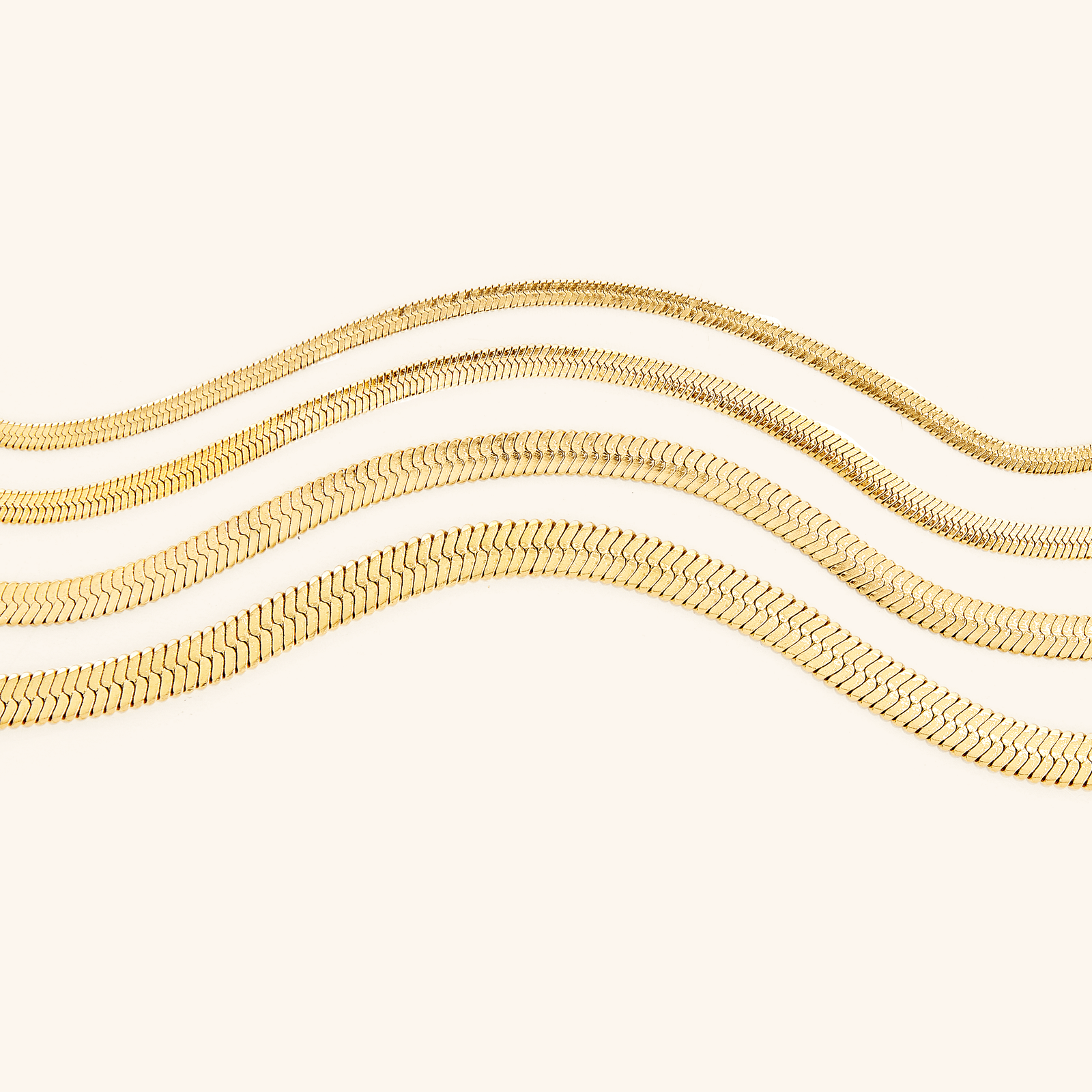 Flat lay of the Essential Herringbone Bracelets in its four variations.