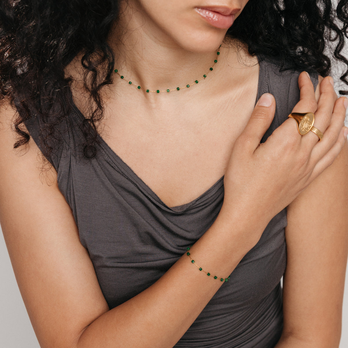 Model wearing 18k gold plated Essential Emerald Micro Bracelet and featuring Essential Emerald Micro Chain.