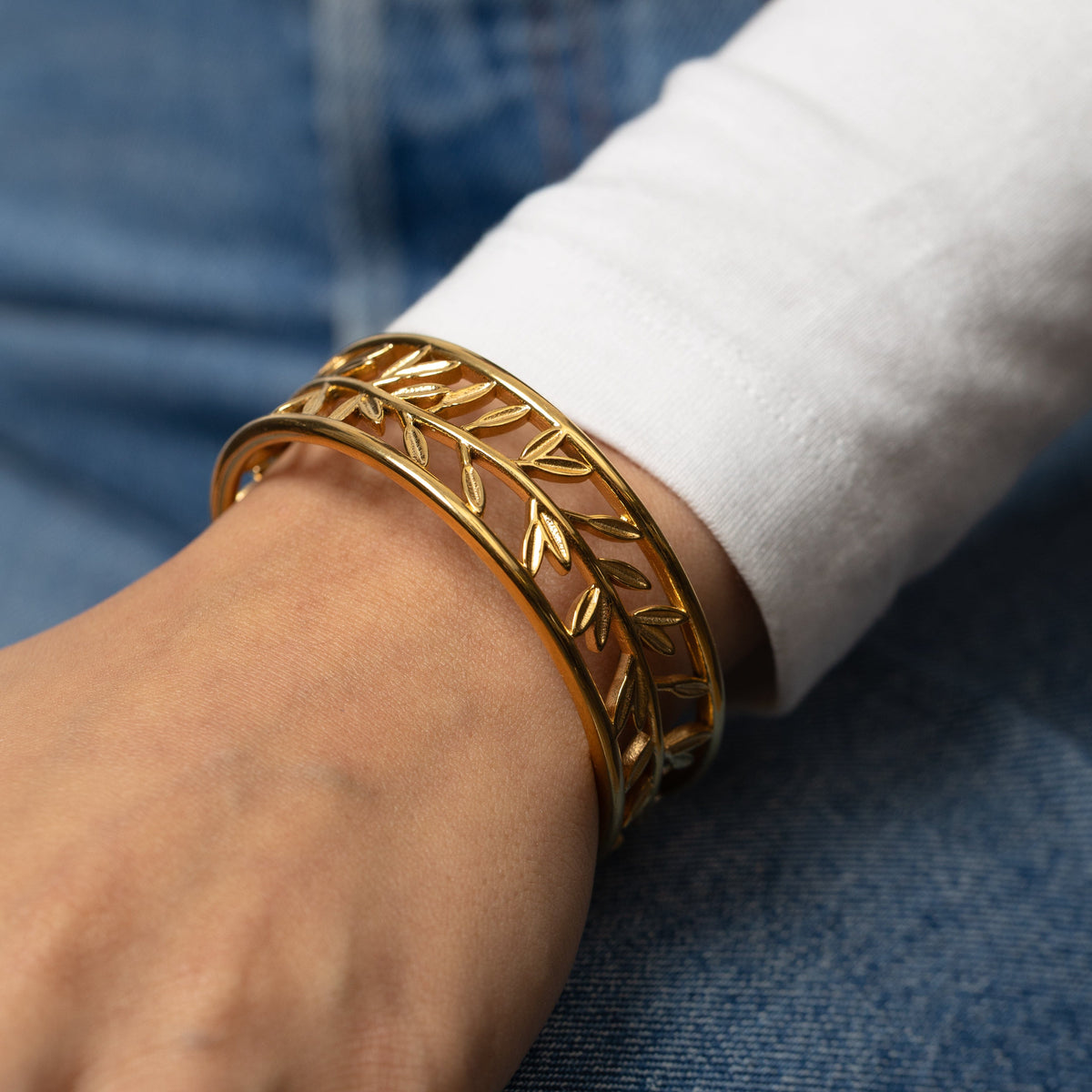 Gold Eternal bangle on a wrist 
