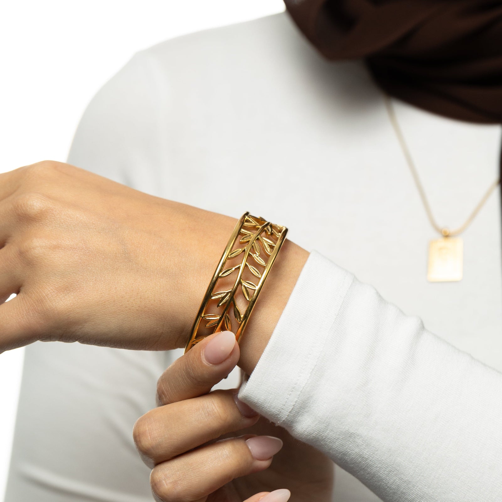 Gold Eternal bangle on a wrist