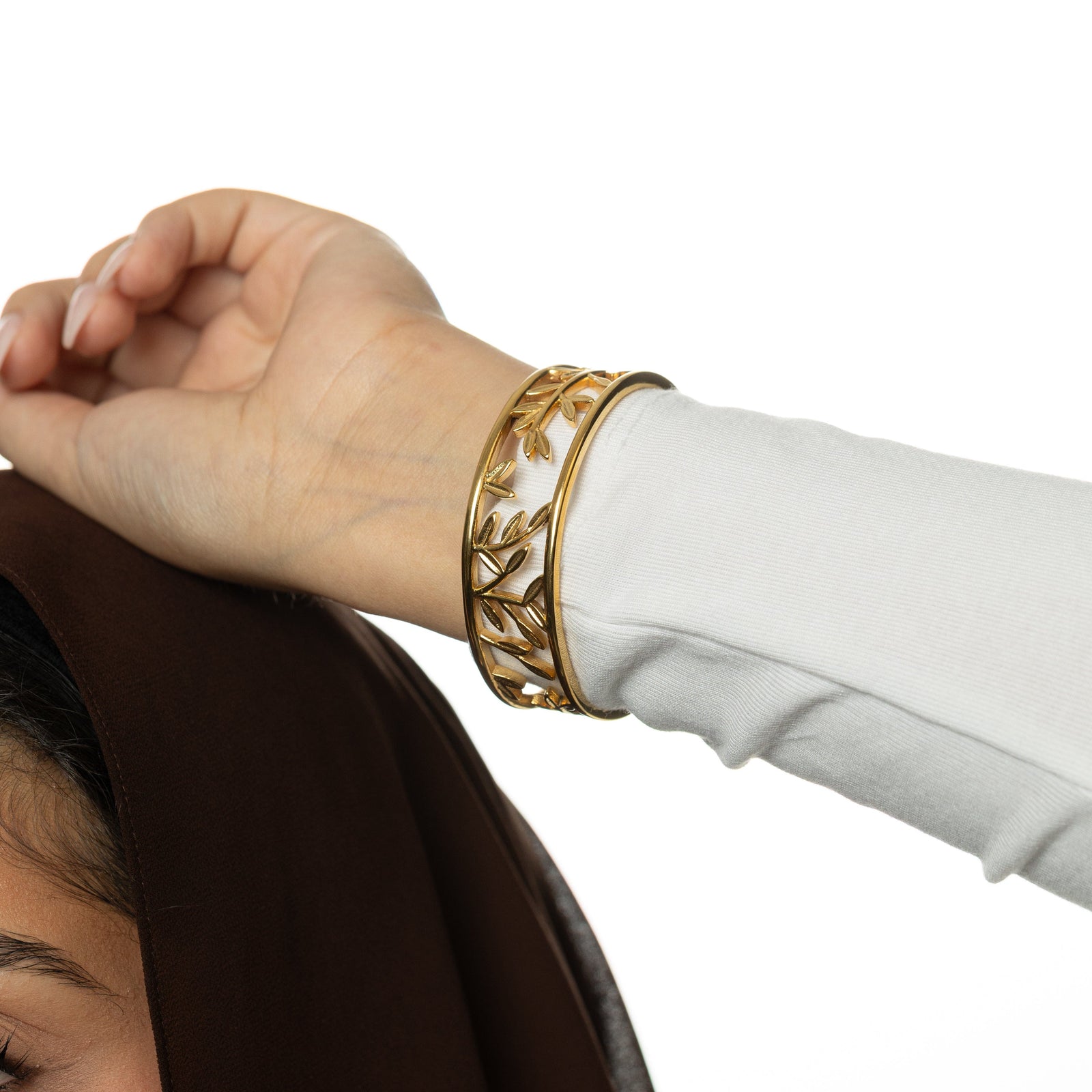 Gold Eternal bangle on a wrist