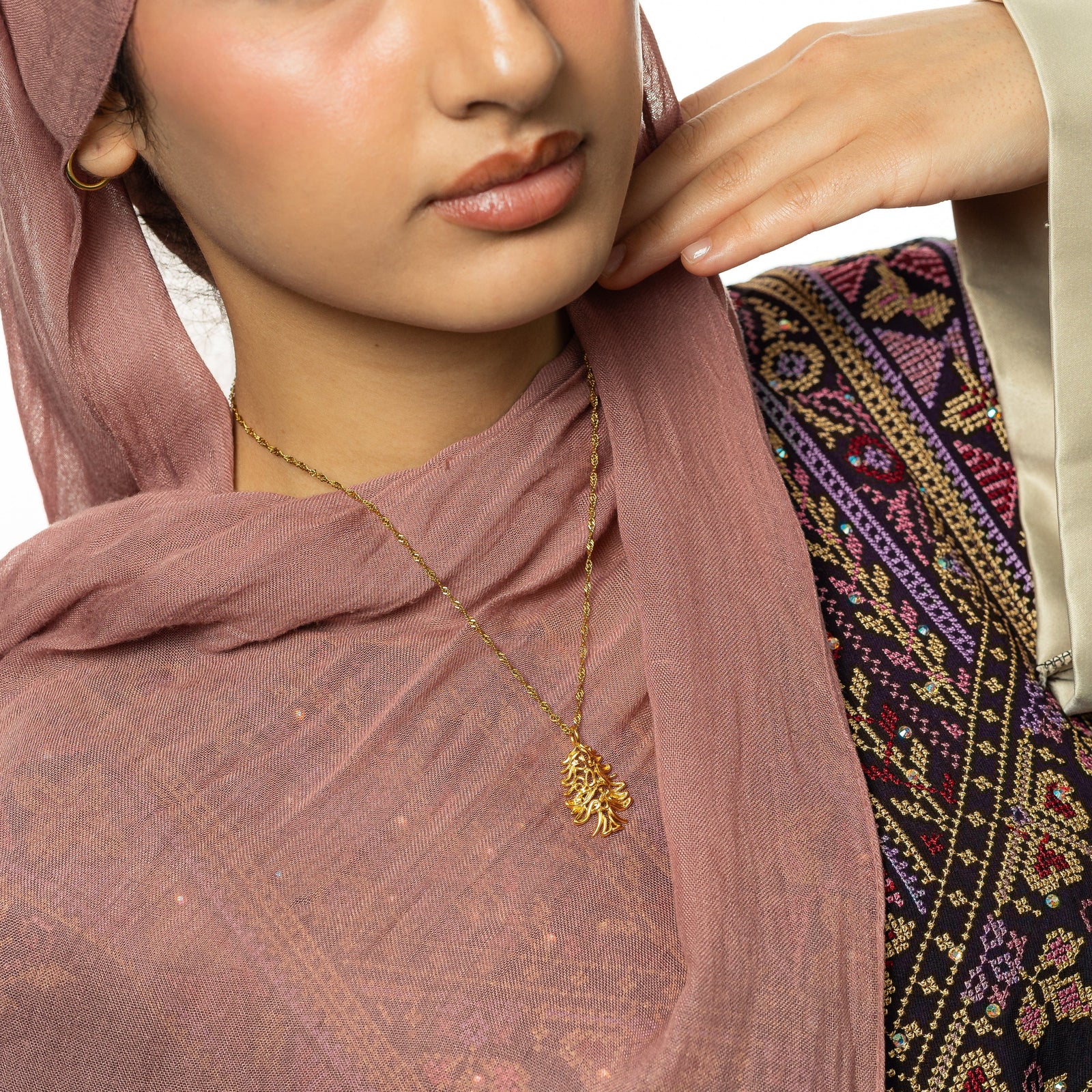 Photo shows the model wearing the gold Freedom is the Soul Lebanon Cedar Necklace.