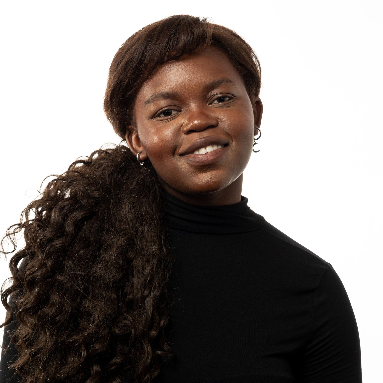 Photo of the model smiling to the camera. The model is wearing the silver Galaxy Hoop Earrings.