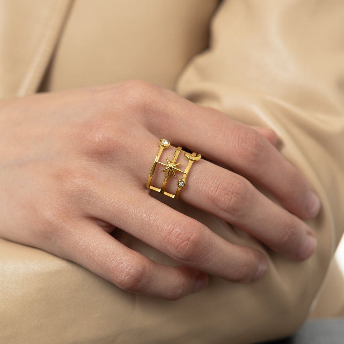 A model wearing the 18K gold-plated Galaxy Stack Ring on her finger. 