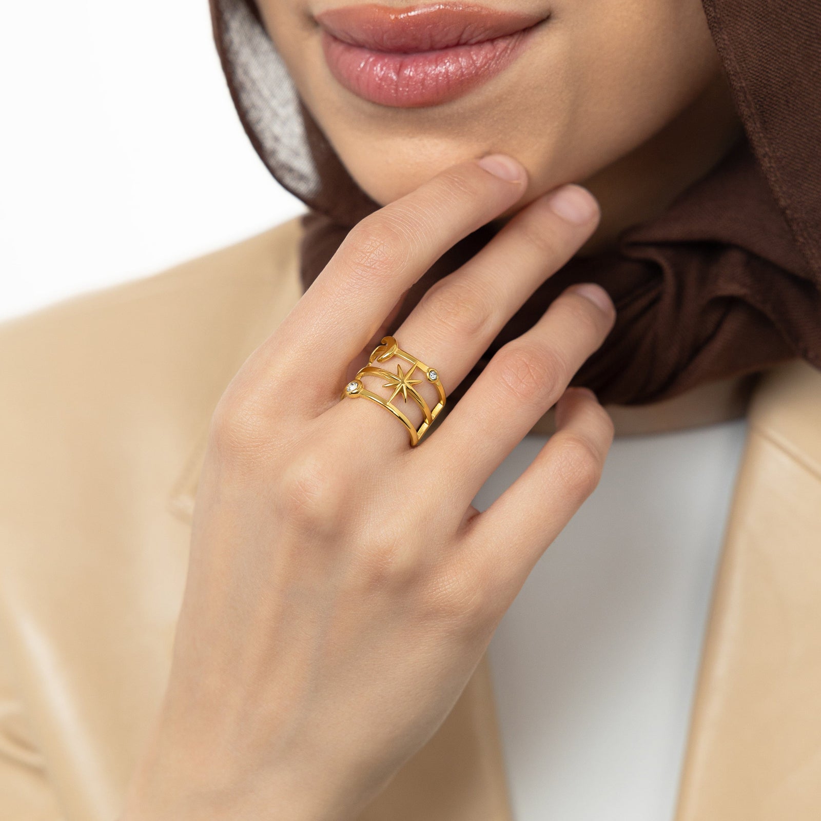 A model wearing the 18K gold-plated Galaxy Stack Ring on her finger. 