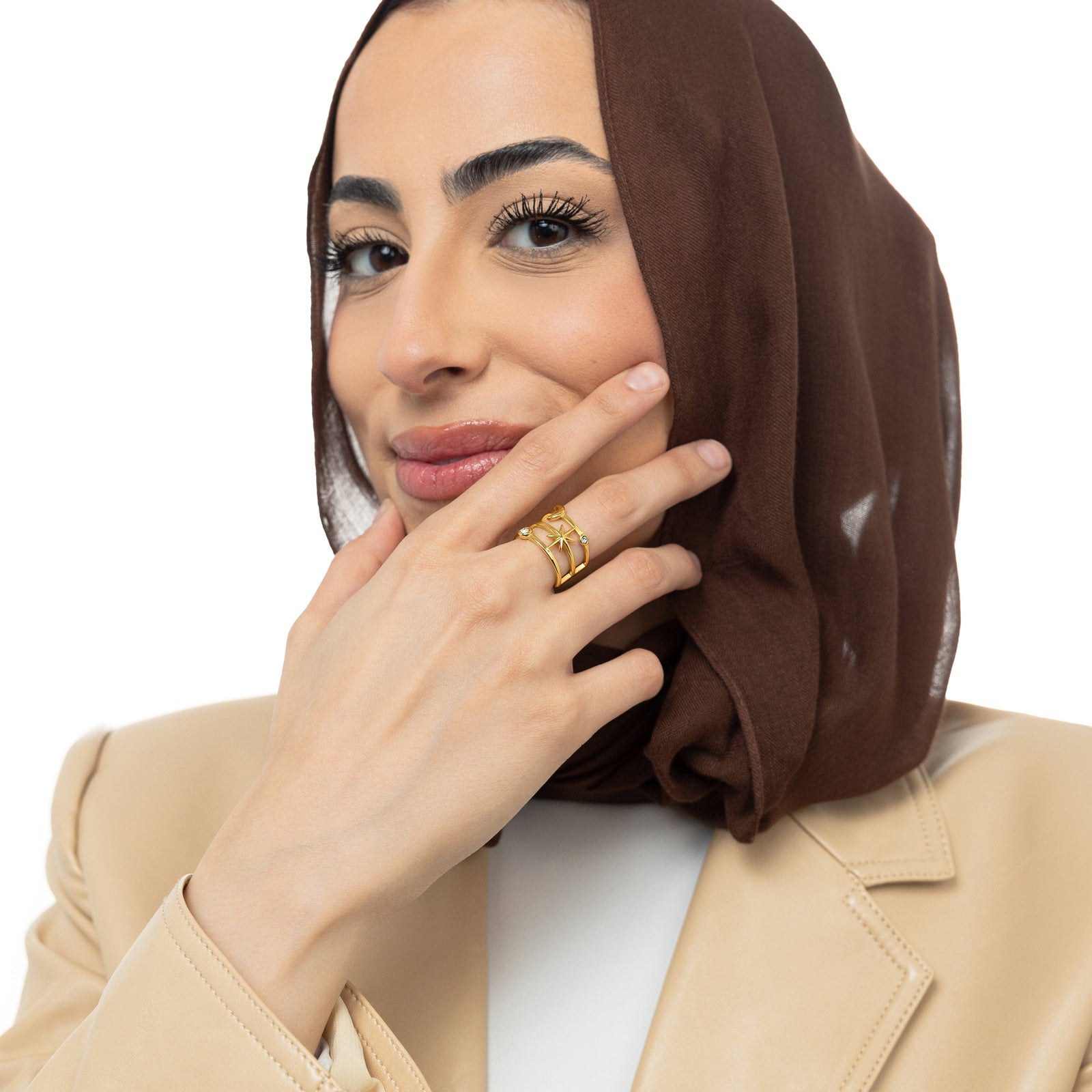 A model wearing the 18K gold-plated Galaxy Stack Ring on her finger. 