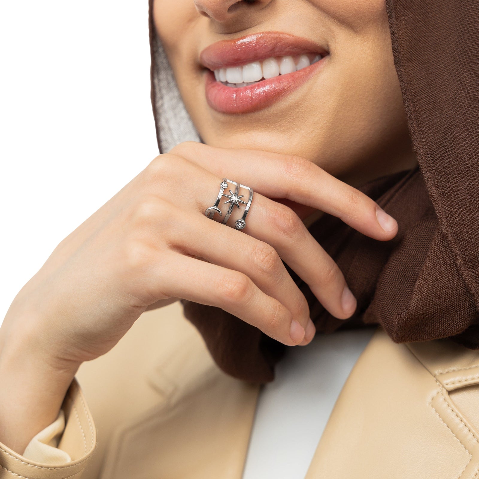 A model showcasing the silver Galaxy Stack Ring on her finger. 