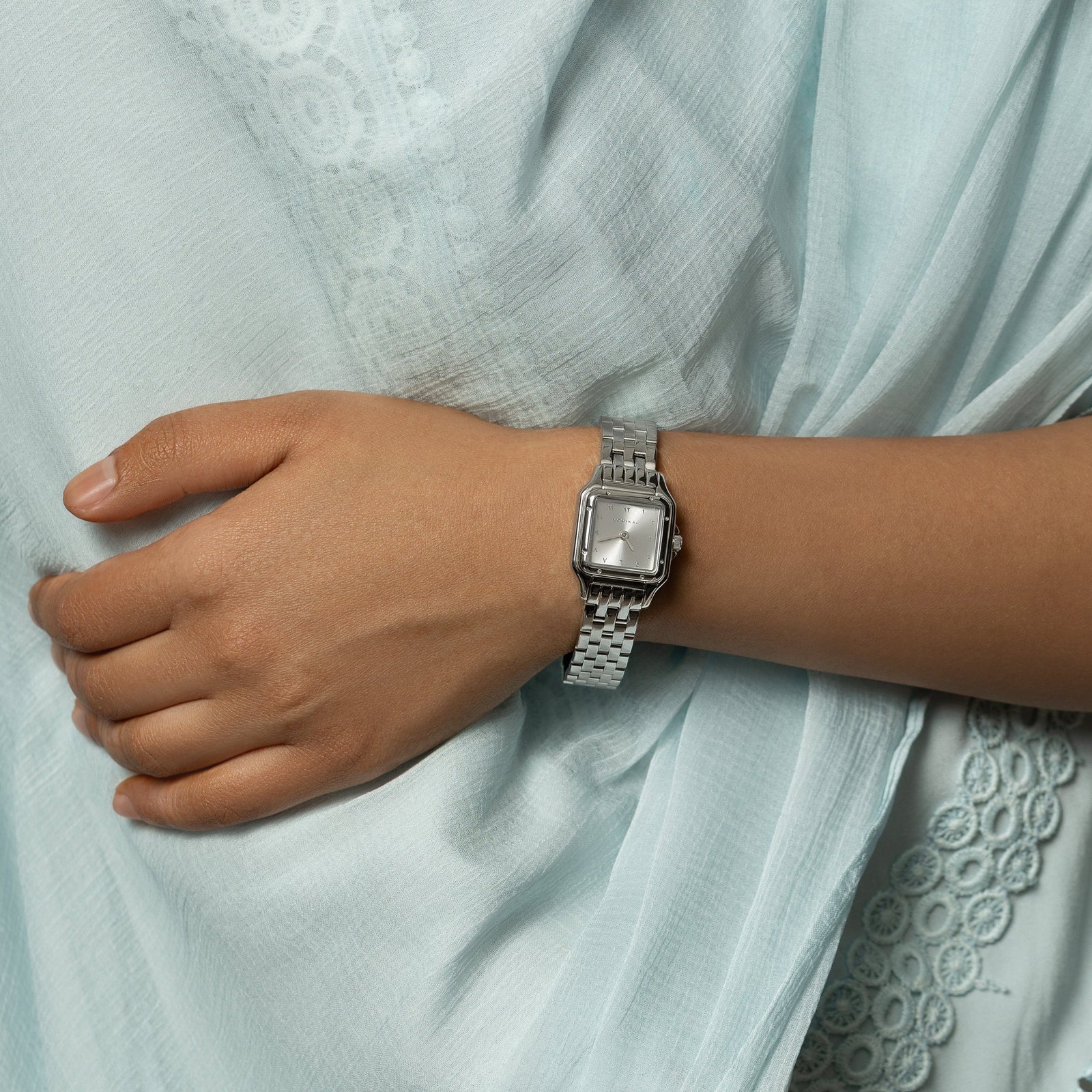 Model's left hand wearing the Glacier watch.