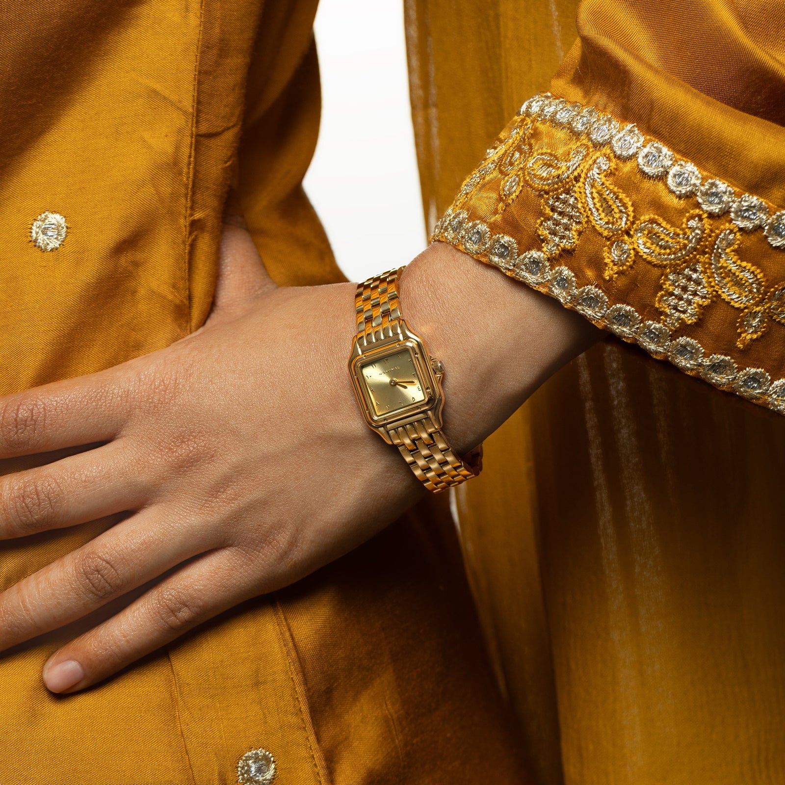 Close up photo of the watch as worn by the model.