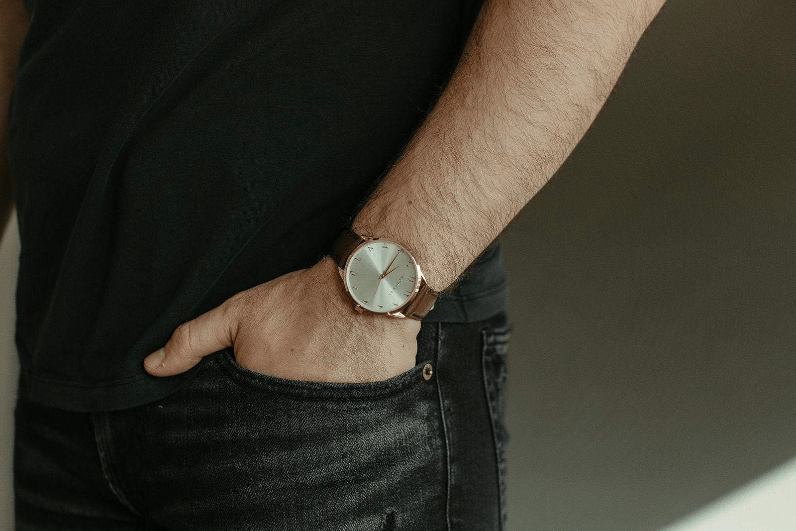Close up of the Voyage watch as worn by the model on their left wrist.