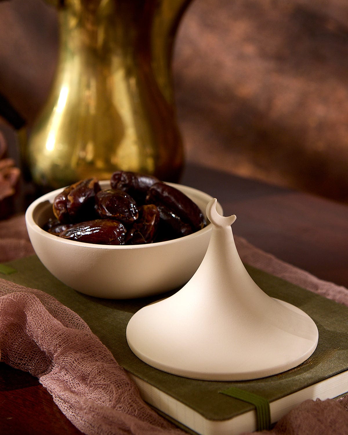 Photo of the Crescent Hosting Bowl displayed and containing brown dates.