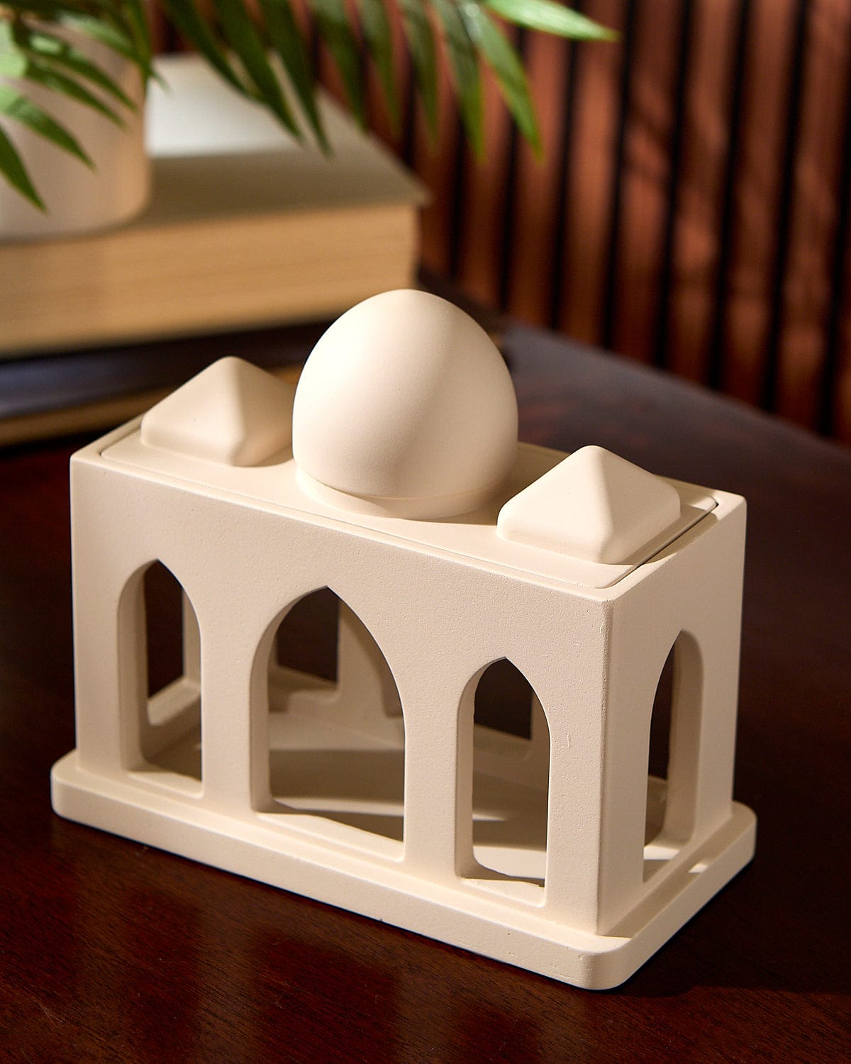 Close up of the Masjid Corridor Decorative Sculpture as displayed on top of a table.