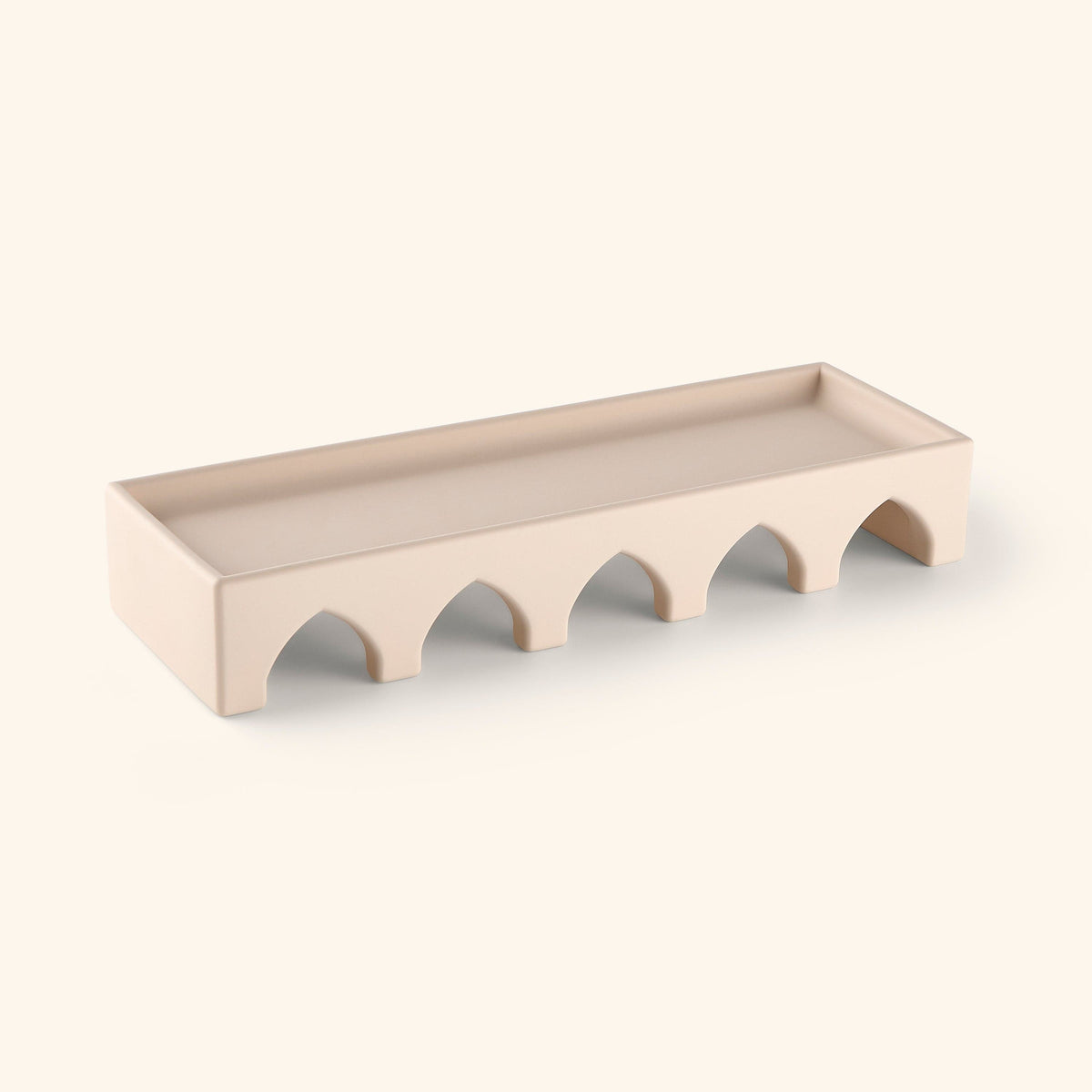A concrete beige decor piece with design pulled from the Islamic architecture that lines mosques, courtyards, and centuries-old buildings across the Middle East and North Africa.