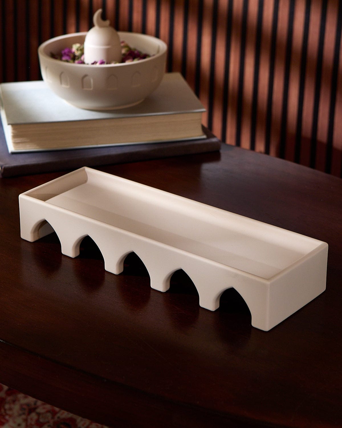 The Arches Decorative Sculpture placed on top of a table.