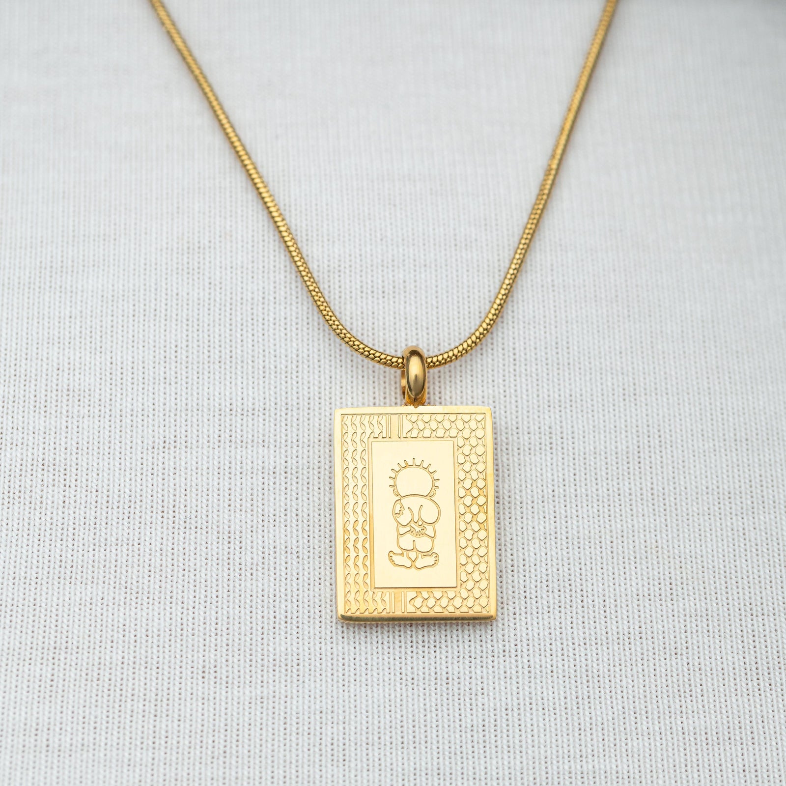 Handala Necklace on a light gray background