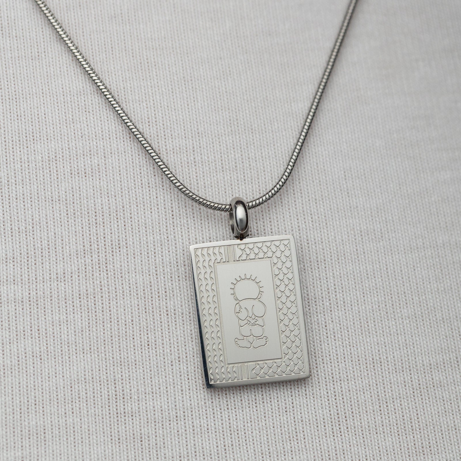Silver Handala Necklace on a light gray background
