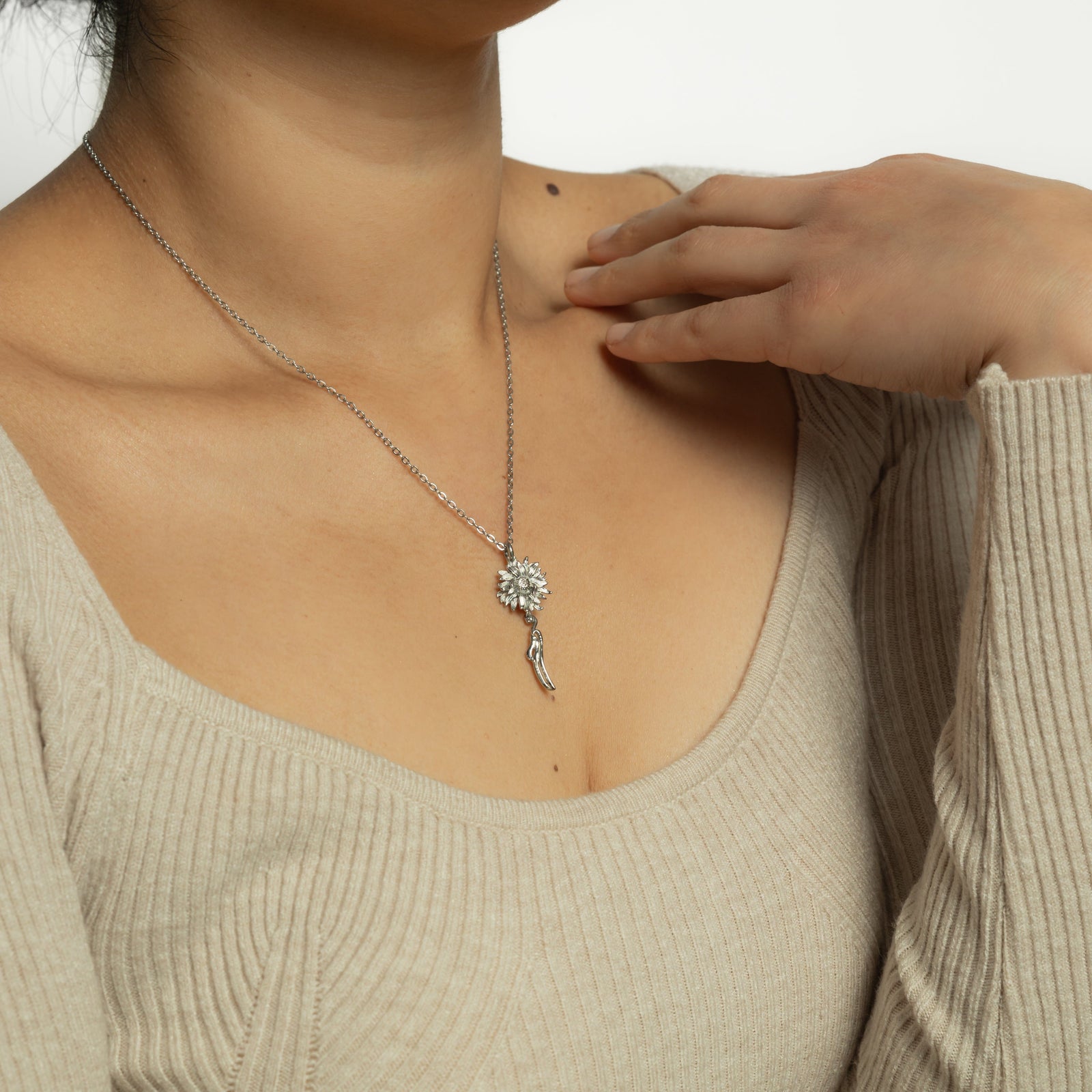 Photo of the model wearing the silver Happiness' Sunflower Necklace.