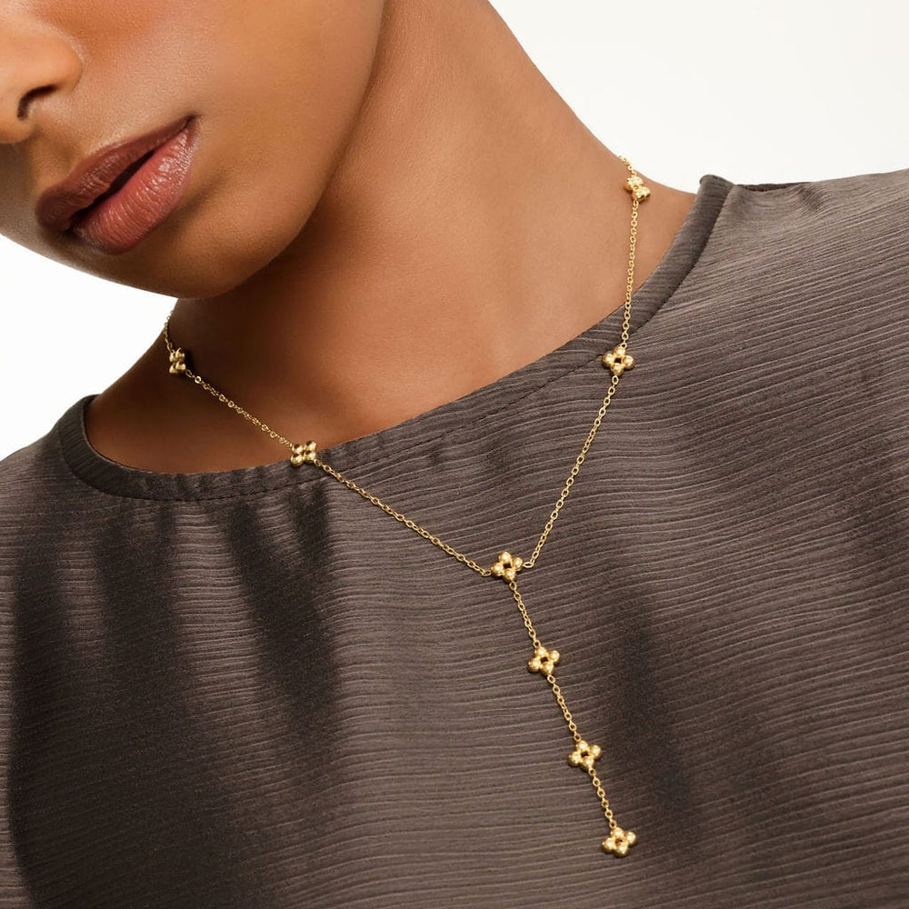 Close up of the gold Henna Lariat Necklace as worn by the model.