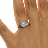 Woman wearing the silver Homeland Ring with Arabic calligraphy on the oval face in a close-up hand shot.