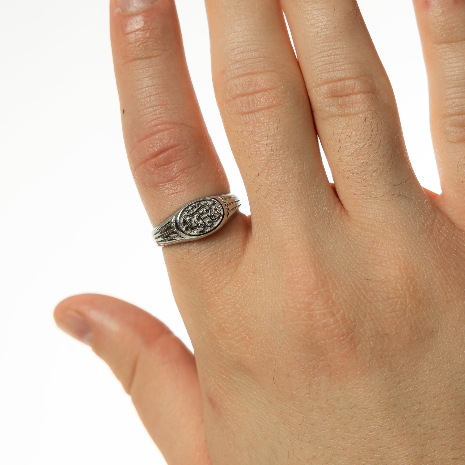 Photo of the model's right hand wearing the silver In Our Hearts Vintage Ring | Men on their right index finger.