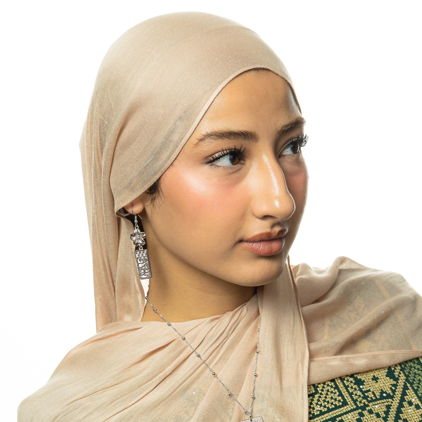 Picture of the model wearing the silver In Our Hearts Damascus Earrings.