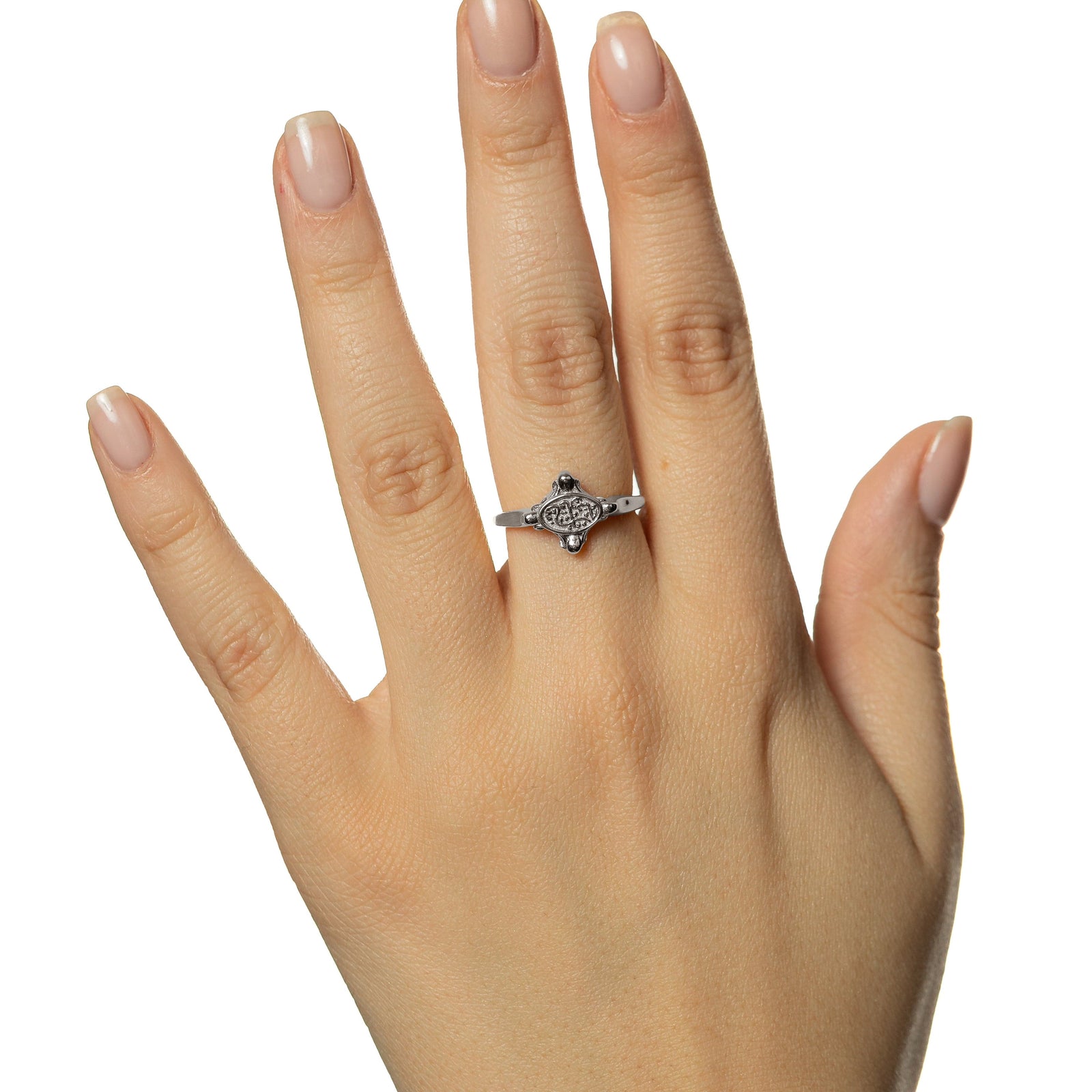 Picture of the model's hand wearing the silver In Our Hearts Vintage ring.