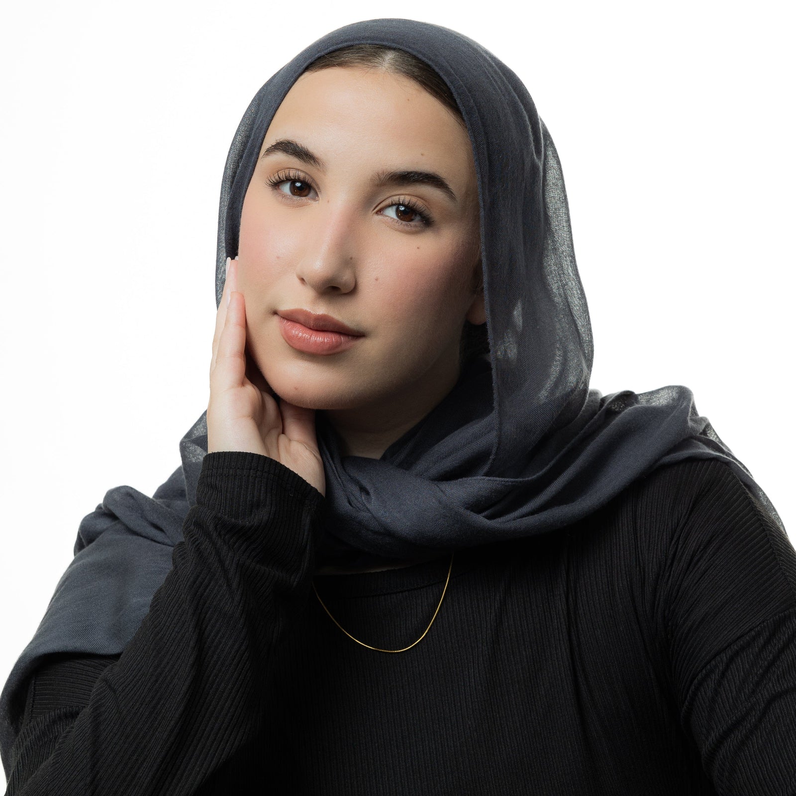 Photo of the model wearing the gold Micro Harmony Chain.