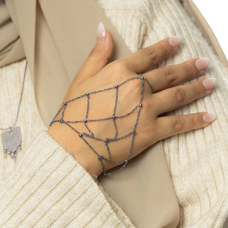 Silver Keffiyeh Fishnet Hand Chain worn across the hand