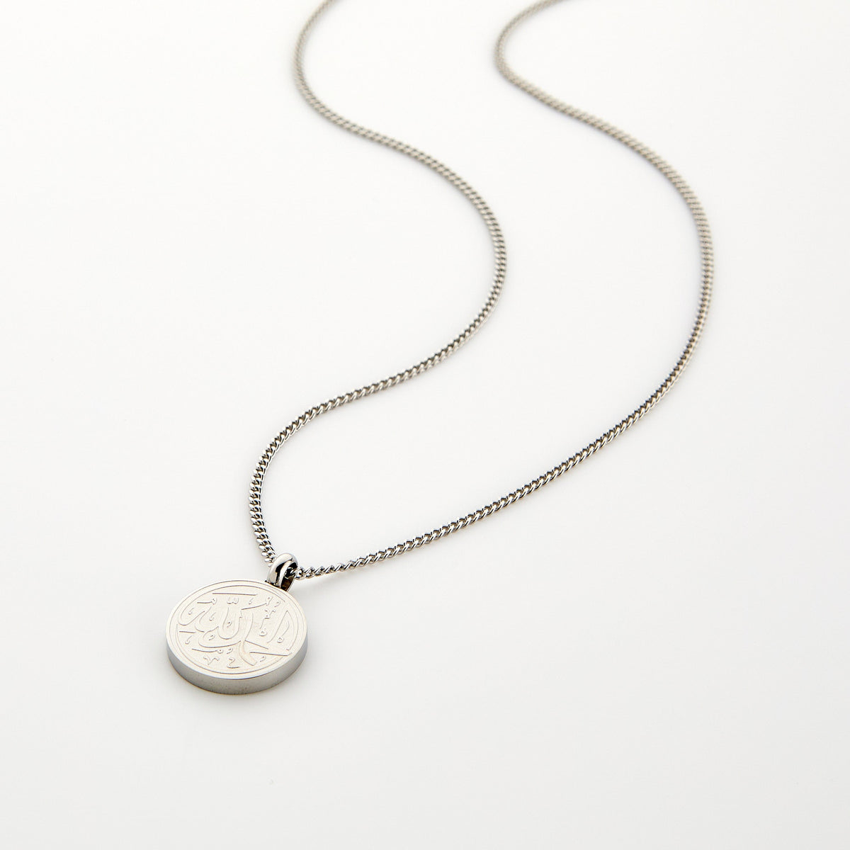 Silver necklace with a circular pendant engraved with 'Alhamdulillah' calligraphy, displayed on a white background.