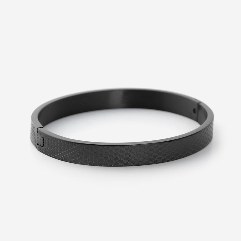 Black Keffiyeh Bracelet for men with an engraved keffiyeh-pattern band and hinge closure.
