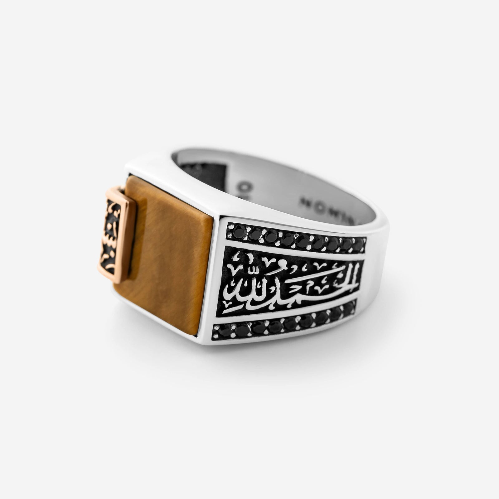 Close up of Bismillah, Alhamdulillah Tiger's Eye Sterling Silver Ring against a white background.