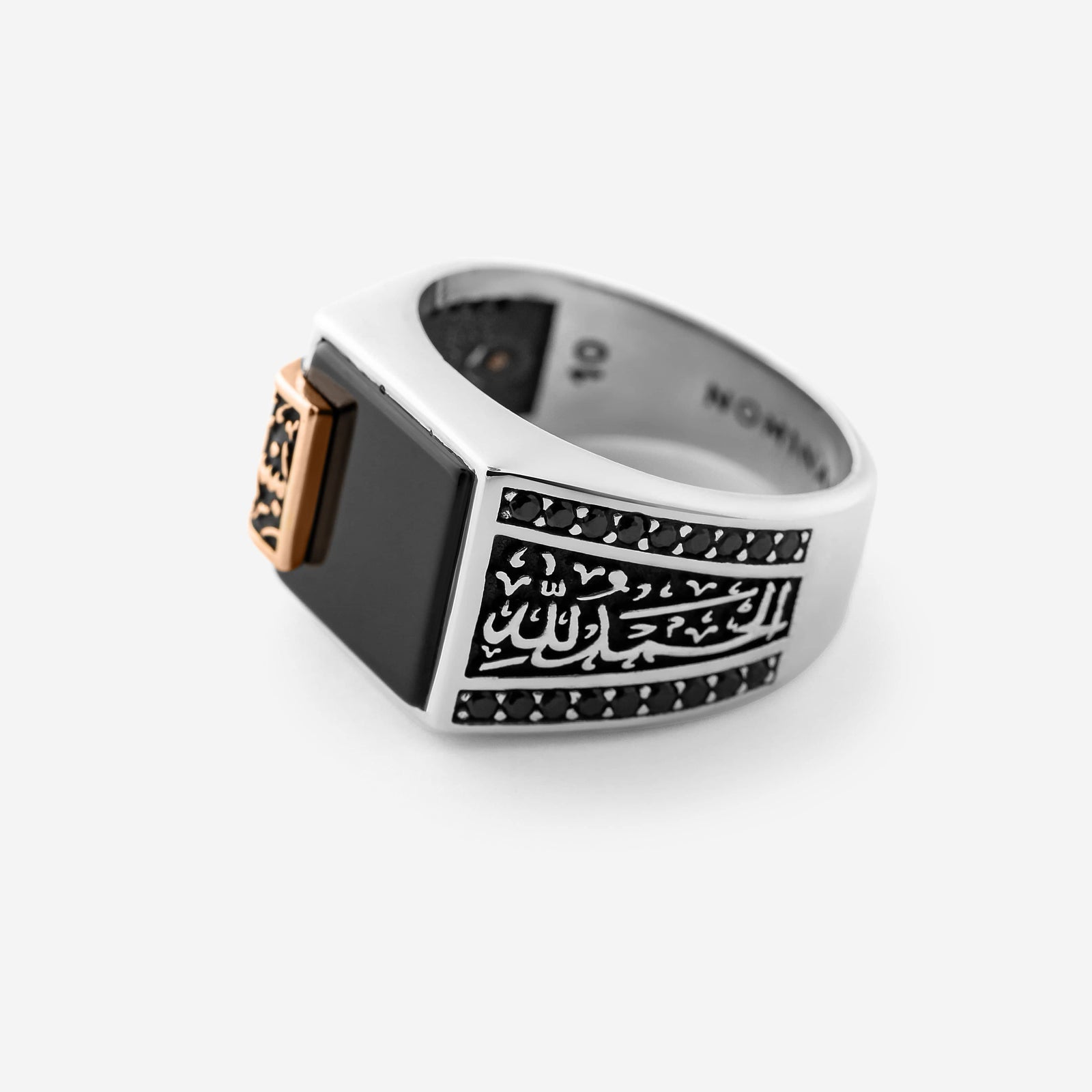 Close up of the Bismillah, Alhamdulillah Onyx Sterling Silver Ring against a white background.