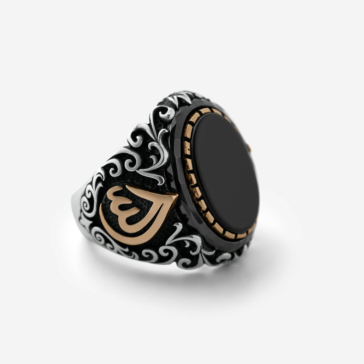 Men’s silver ring with a black onyx stone and an Arabic calligraphy detail of the word ‘Allah,’ surrounded by ornate black and silver engravings.