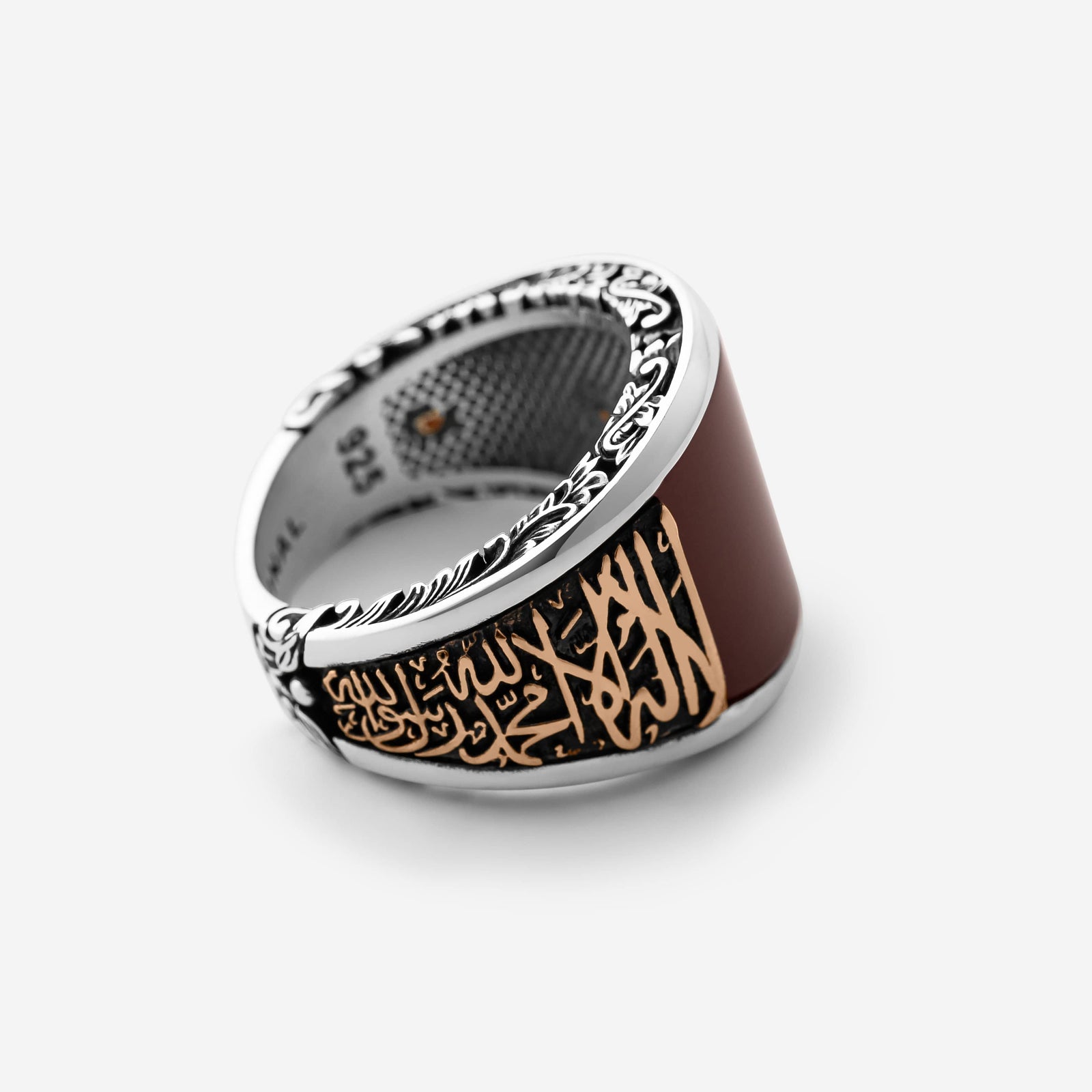Close up of the Shahada Agate Sterling Silver Ring against a light background.